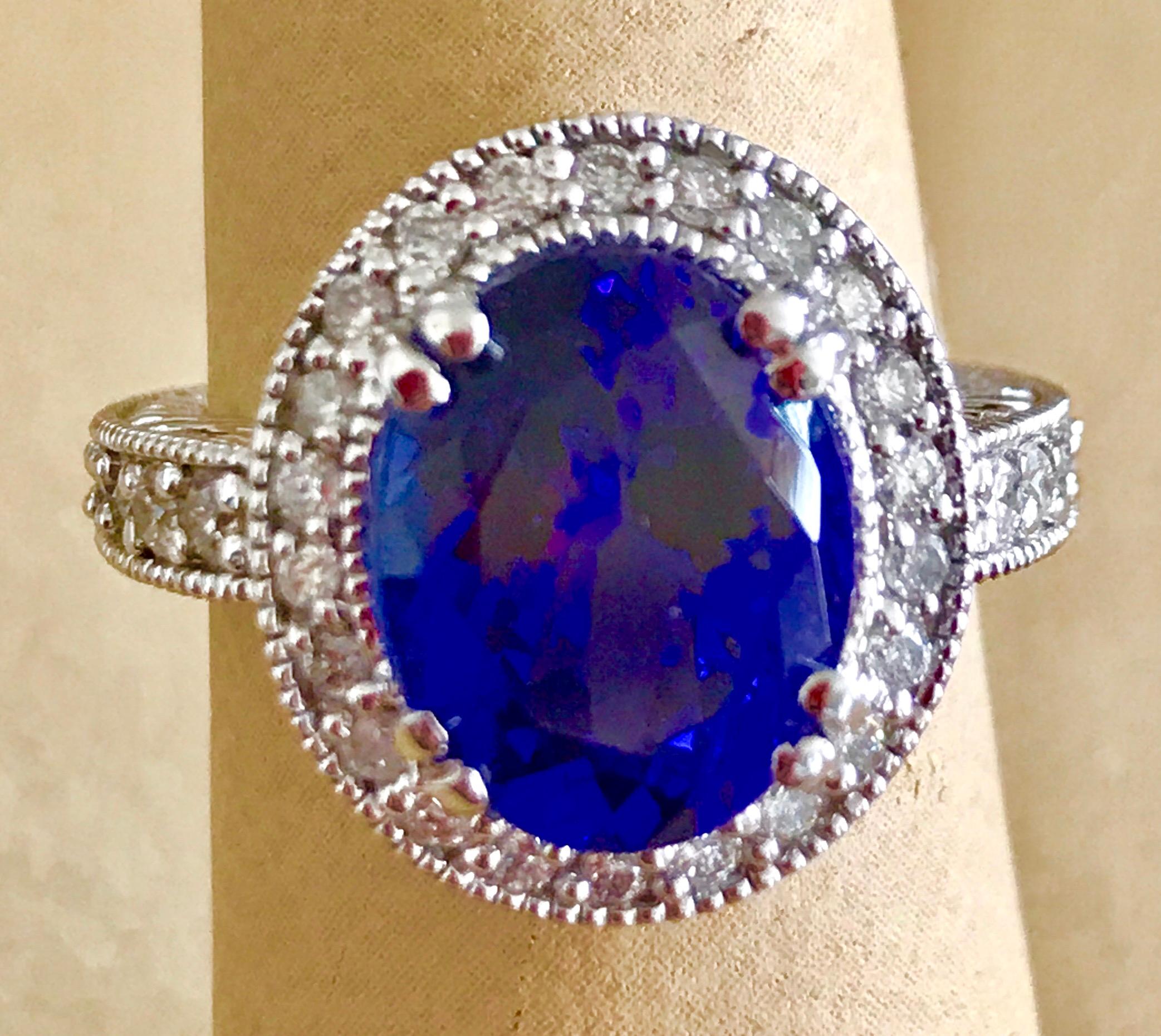 This extraordinary, 6 carat tanzanite is truly an extraordinary gemstone. There are  total  of 1.0 carats of shimmering white diamonds, this brilliant Oval-cut gem exhibits the rich violetish-blue color for which these stones are known and so highly