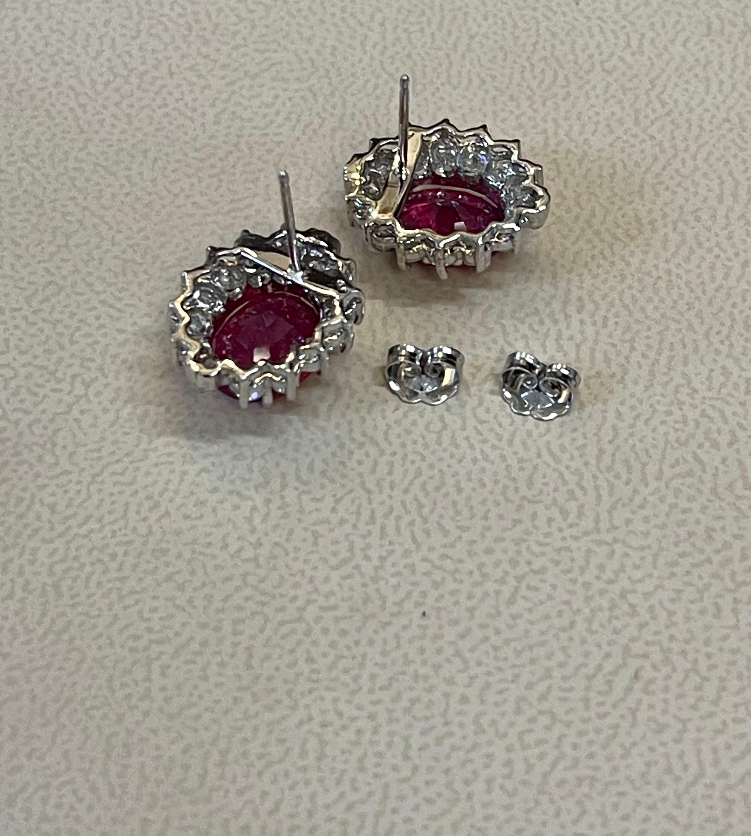 Oval Cut 6 Carat Oval Treated Ruby & 1.2 Ct Diamond Stud Earrings 14 Karat White Gold For Sale