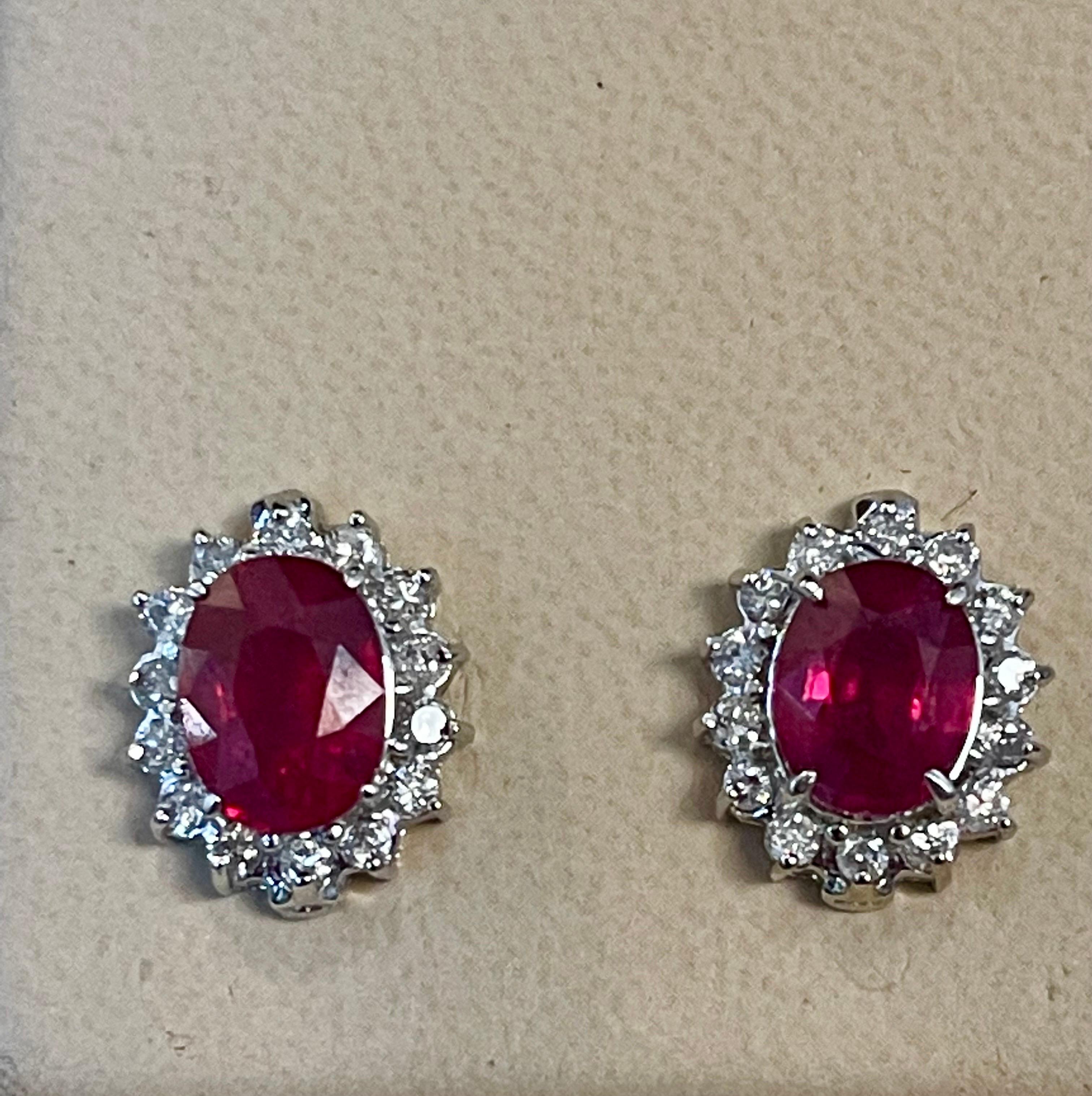 Women's 6 Carat Oval Treated Ruby & 1.2 Ct Diamond Stud Earrings 14 Karat White Gold For Sale