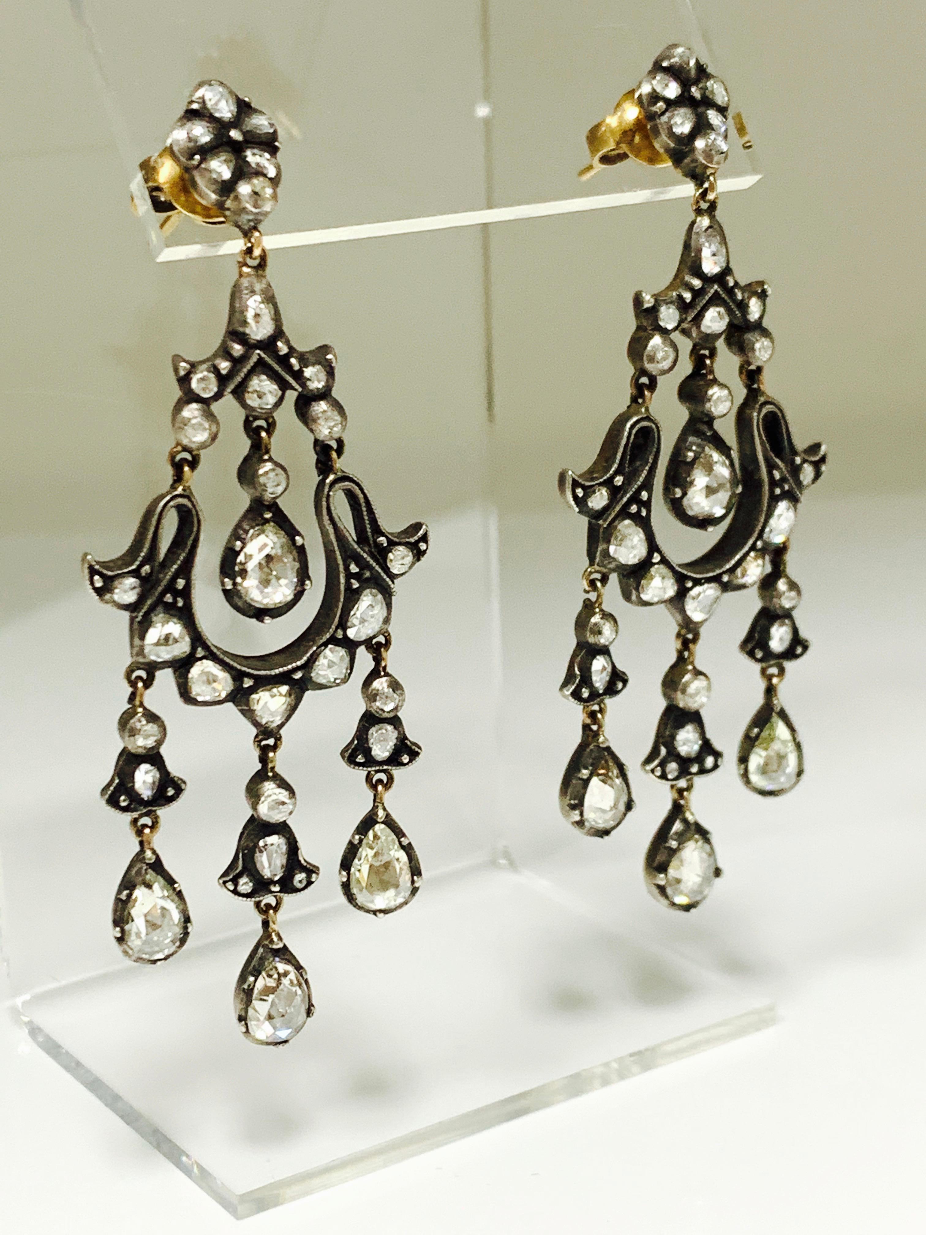 These unique antique style rose cut diamond earrings are handcrafted in 18k gold and silver. 
The details are as follows : 
Rose cut diamond weight : 6 carat 
Metal : 18 k gold and silver 
Measurements : 2.75 inch by 1 inch 
