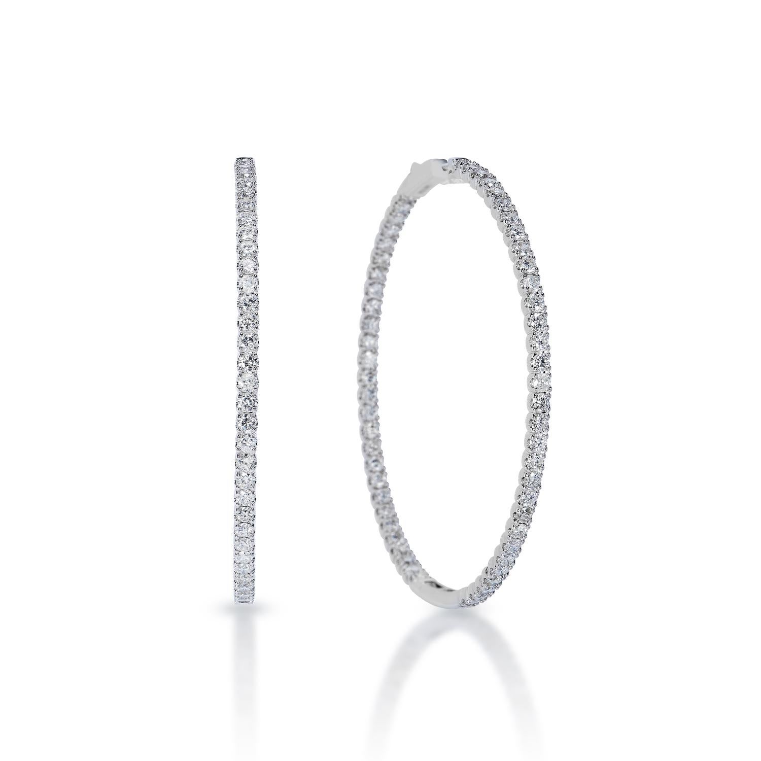 Diamond Hoop Earrings:

Carat Weight: 5.50 Carats E.E
Shape: Round Brilliant Cut
Metal: 14 Karat White Gold
Style: Hoop Earrings