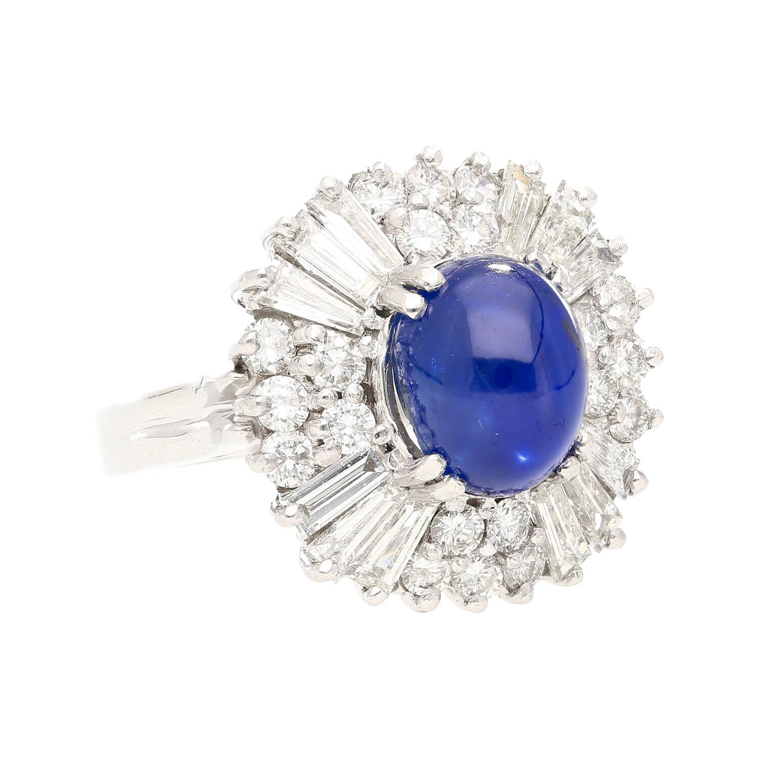 Oval Cut 6 Carat Royal Blue No Heat Burma Star-Sapphire and Diamond Halo Ring in Platinum For Sale