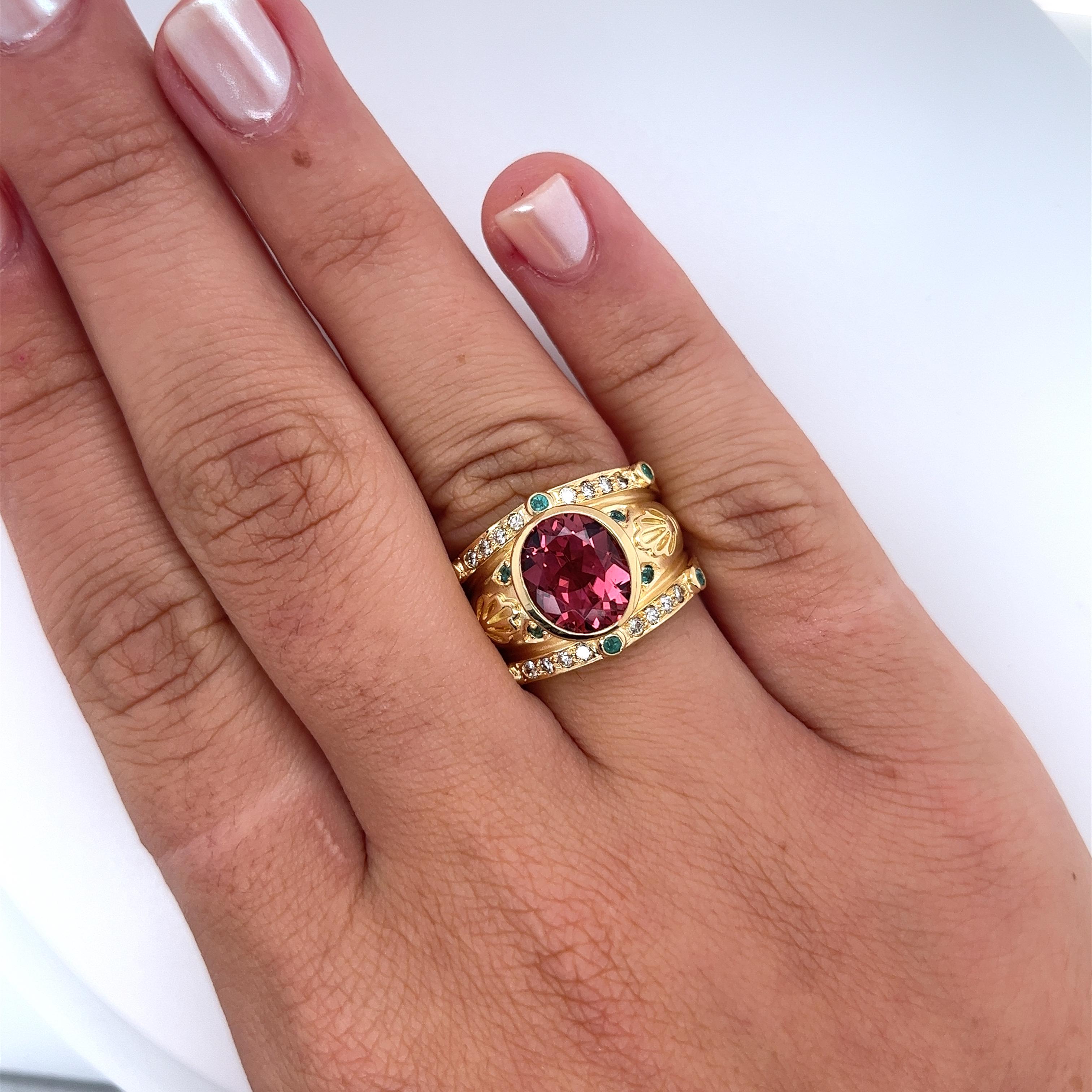Vintage 6CTTW Oval Cut Pinkish-Red Tourmaline Ring featuring stunning Neon Paraiba Tourmaline and Diamond Side Stones. Crafted in 18K Yellow Gold and weighs 15.5 grams.

This semi-precious ring from a bygone era is characterized by the bezel set