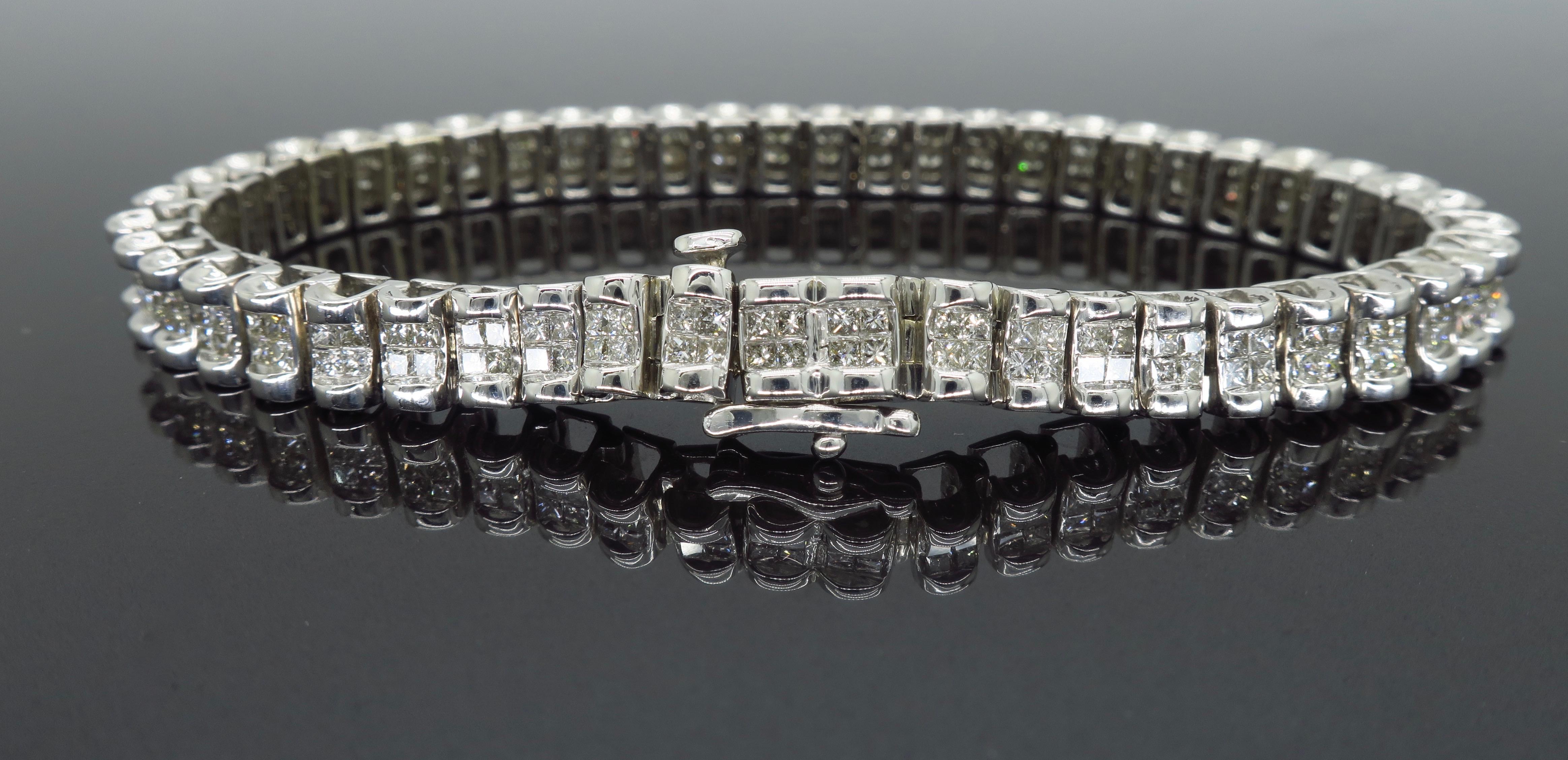 This unique tennis bracelet has 50 links with 4 invisible set princess cut diamonds in each link, for a beautiful design of approximately 6.00CTW of diamonds.

Diamond Carat Weight: Approximately 6.00CTW
Diamond Cut: 200 Princess Cut Diamonds
Color: