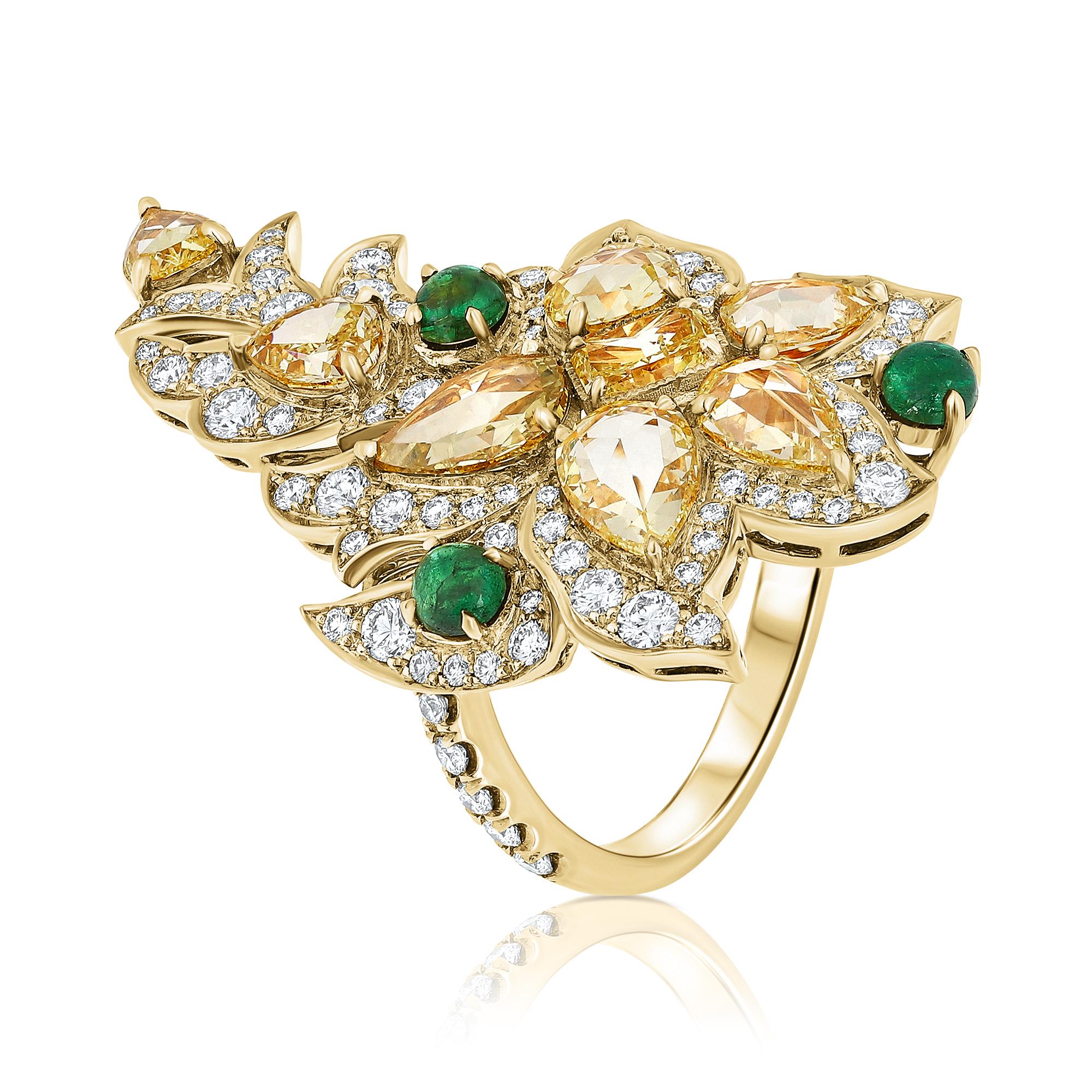 A Exquisite Art Nouveau-Inspired Cocktail-Cluster Ring featuring a captivating blend of a 4.14 Carat Fancy Yellow Mix-Shaped Diamond and a 1.4 Carat F-G Color, VS Clarity Colorless Diamond, elegantly presented in a cabochon cut emerald-adorned