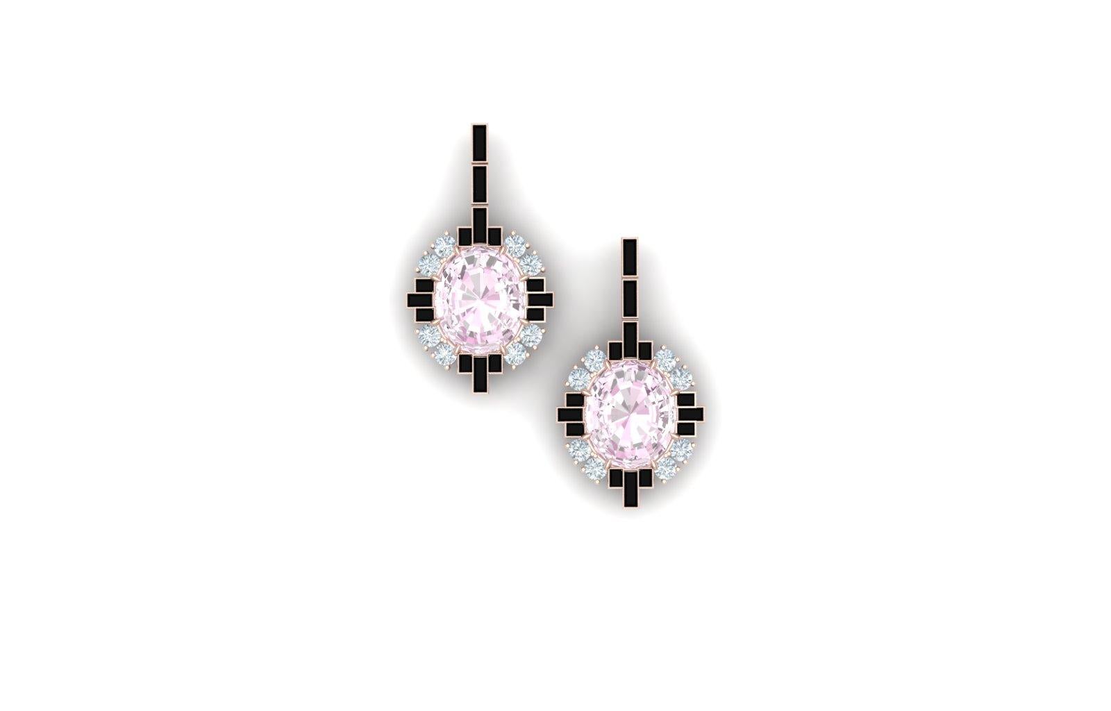 These modern earrings have a the combination of light pastel pink and contrasted with the stark black onyx.  These earrings have a center stone that is oval cut and weighs 1.5 carats each.  The center stone is complemented by 1.2 carats of baguette