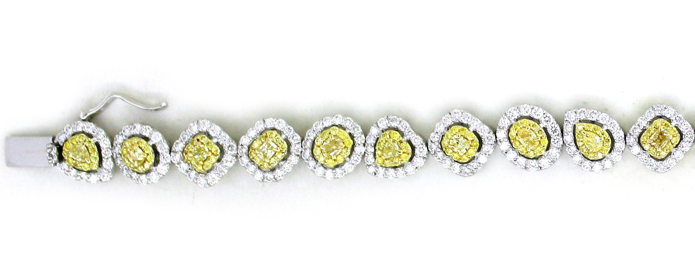 Prepared to be captivated by the sheer magnificence of a modern bracelet that exemplifies opulence, sophistication, and a harmonious blend of precious metals and gemstones.
A splendid ensemble of 20 fancy-shaped yellow diamonds takes center stage,