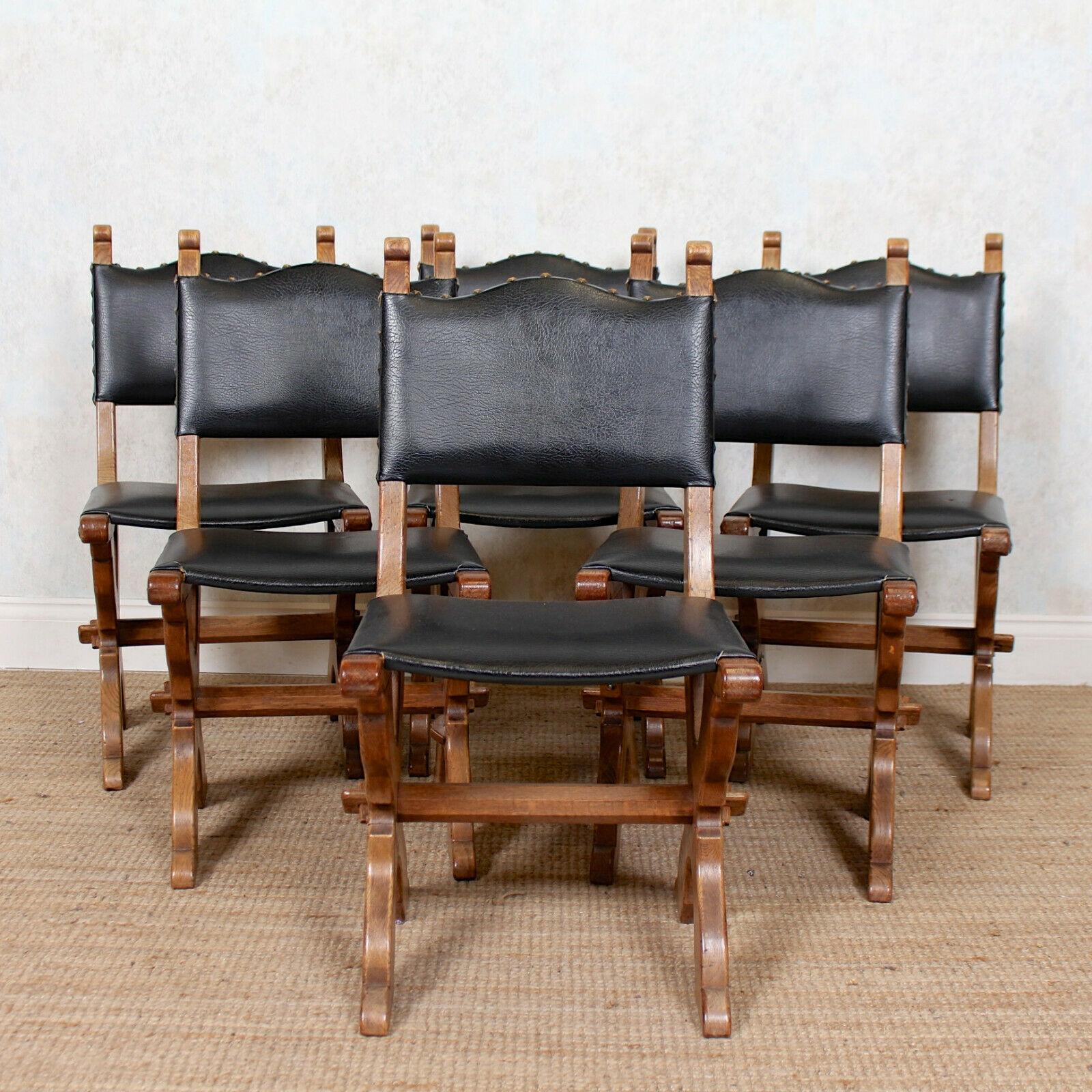 A fine quality set of six carved oak dining chairs in the Gothic manner.
Carved from solid oak using an impressive simple medieval style chip technique.
The upholstered backs and seats bordered with carved studded pegs and raised on carved