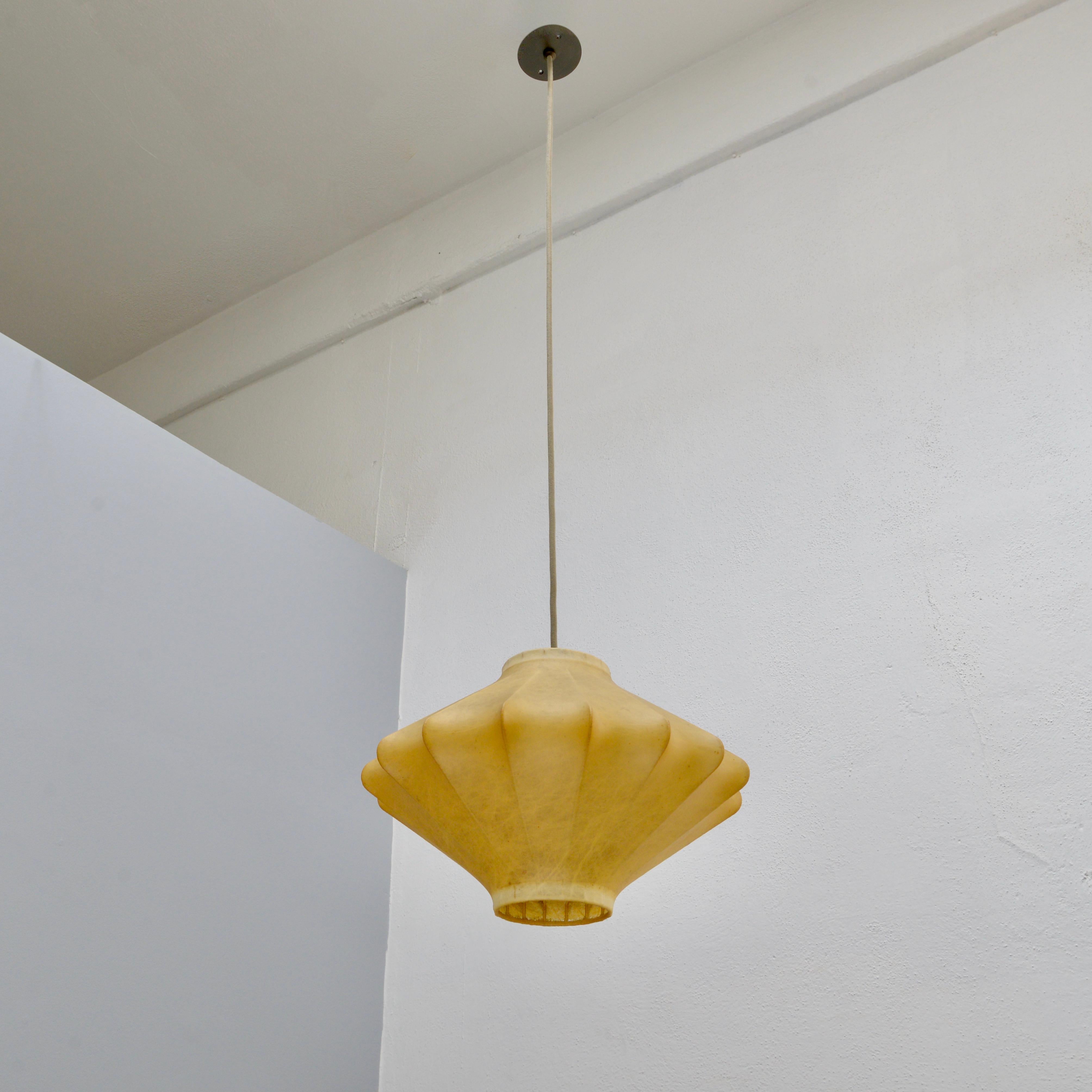 Wonderful 1960s Italian resin pendant by Castiglioni. Partially restored. Known as Cocoon pendant, this fixture is original but has been rewired for use in the US with an E-26 medium based socket. Light bulb included with order. 
Measurements:
OAD: