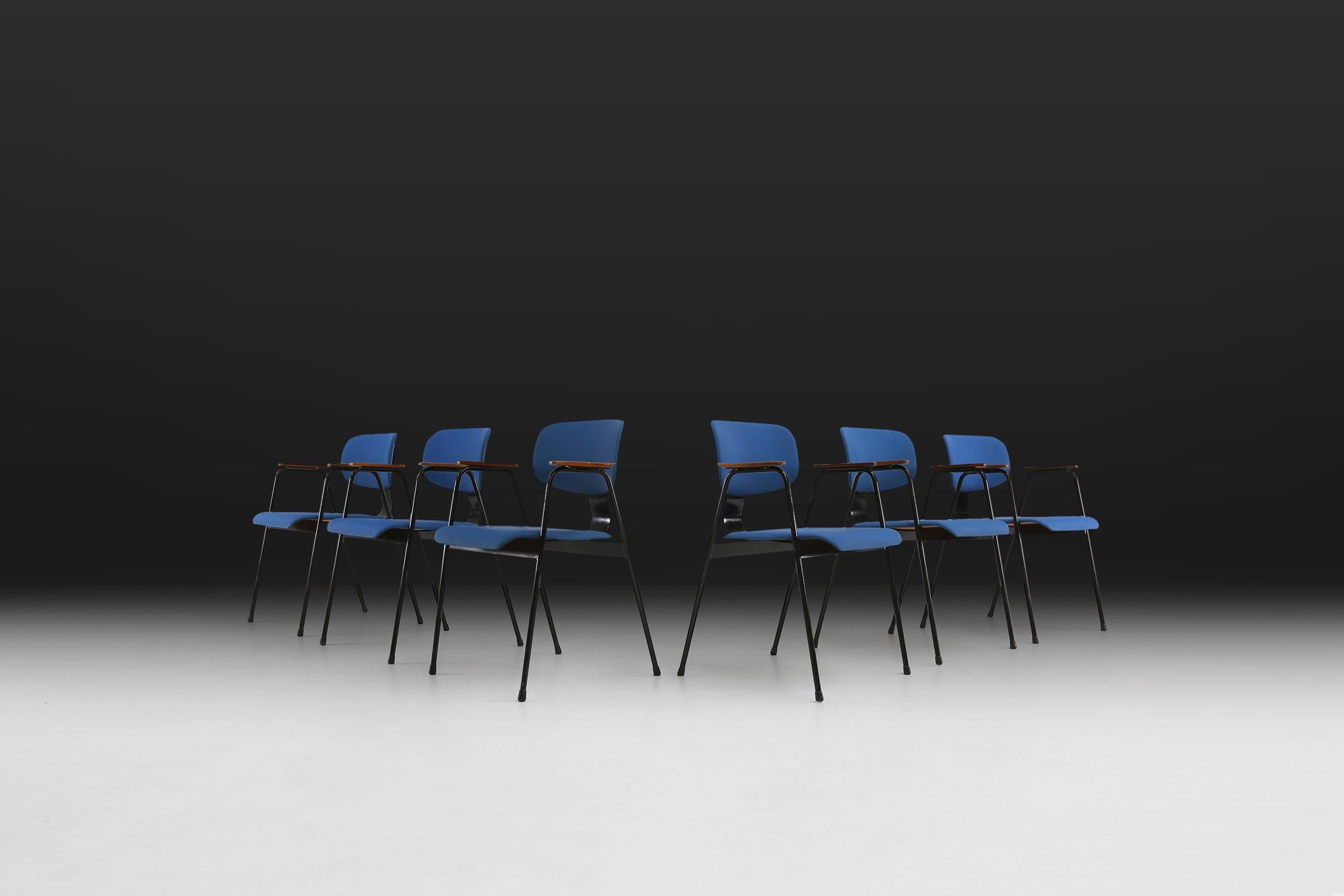 Six chairs by designer Willy Van Der Meeren for Tubax, circa 1950.
Have a black lacquered metal frame with blue vinyl seat.
The armrests are made of wood.

Van Der Meeren is considered one of the most important Belgian furniture designers of the