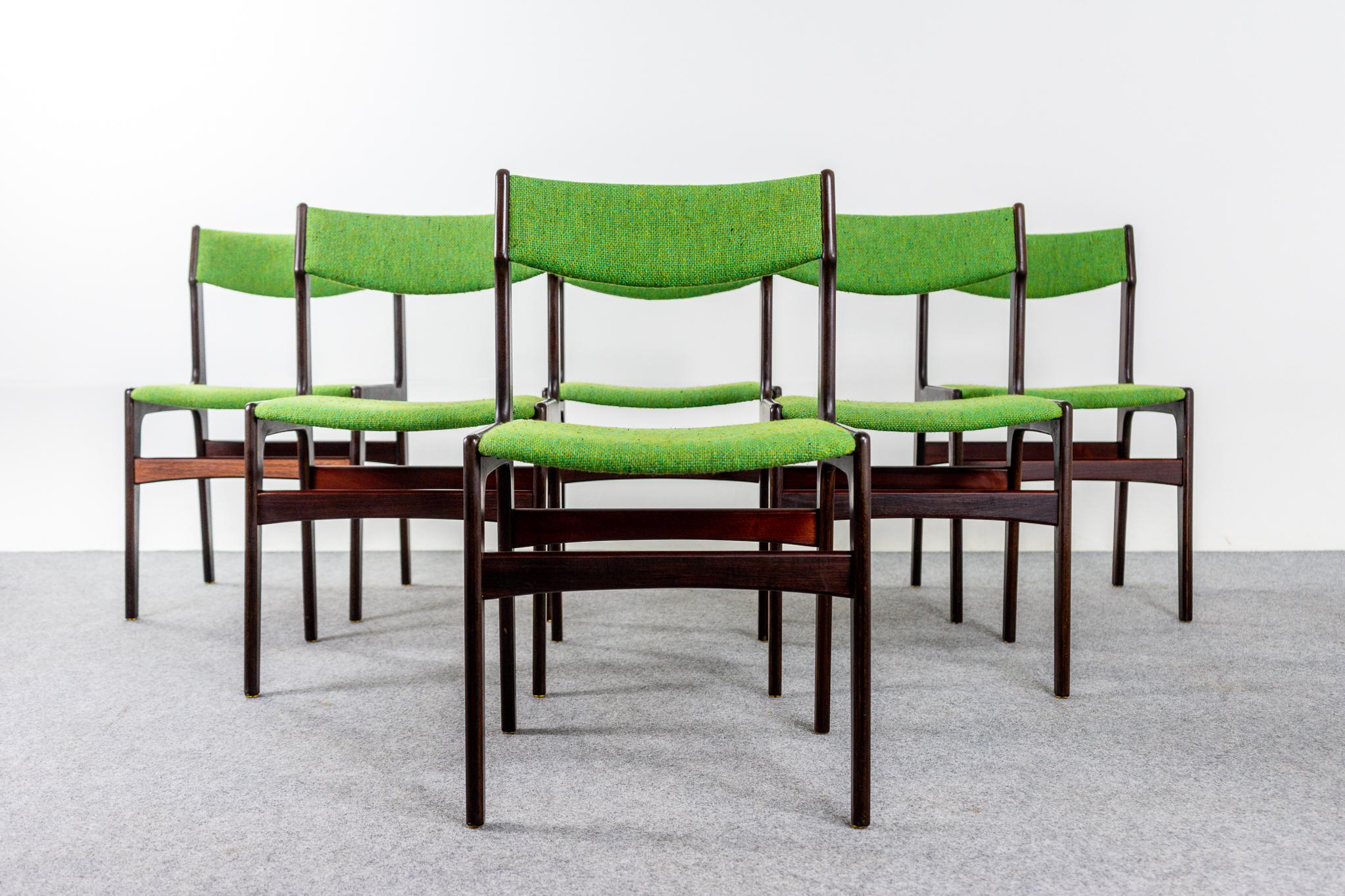Rosewood dining chairs, circa 1960's. Beautifully curved backrests and generous seat design provide support and comfort. Striking original green upholstery contrasts which well with the dark rosewood veneer.  

Unrestored item, some marks consistent