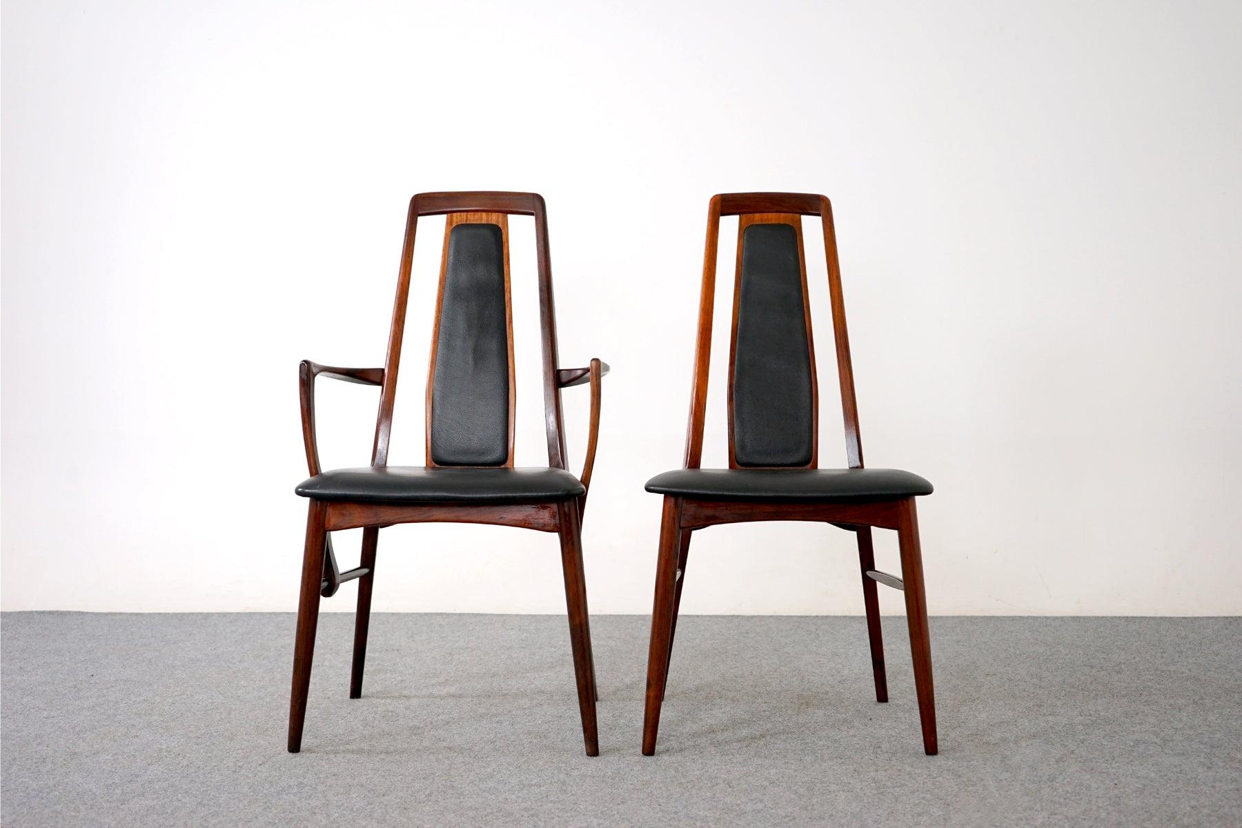 Rosewood dining chairs by Niels Koefoed for Hornslet, circa 1960's. Pure elegance! Beautifully curved backrests and generous seat. The chairs feature a supportive and comfortable tapered high back design. Set contains two rare captains'