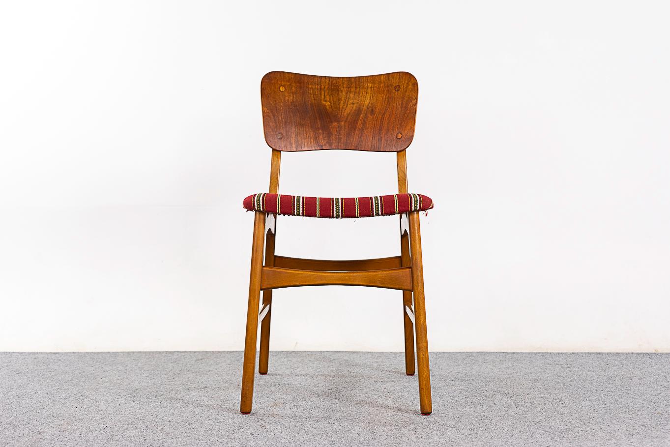 Teak & beech mid-century dining chairs, circa 1960's. Comfortable curved teak backrests contrast nicely with the beech frame. Bowtie cross bars add stability. Original upholstery in nice condition, removable seat pad makes reupholstering a snap!  