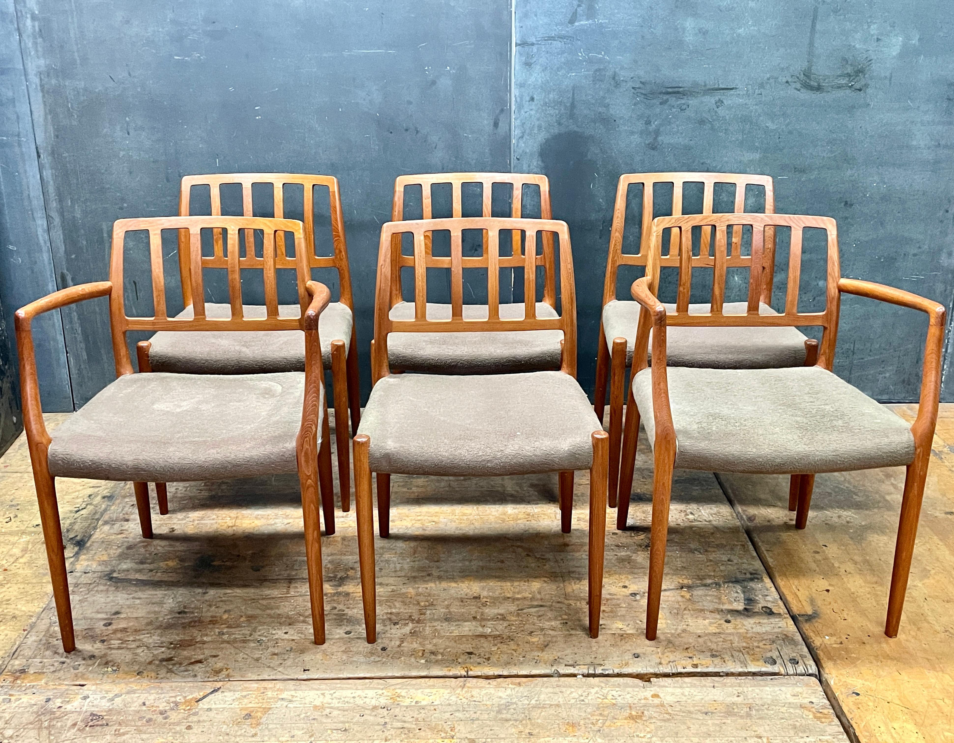 2 armchairs, and 4 side chairs. The teak frames are strong and not loose. However, the upholstery is a old and soiled, and would need to be cleaned or recovered.

Measures: W 19.69 x D 20.08 x H 31.5 in. 
Seat H 17.32 in.