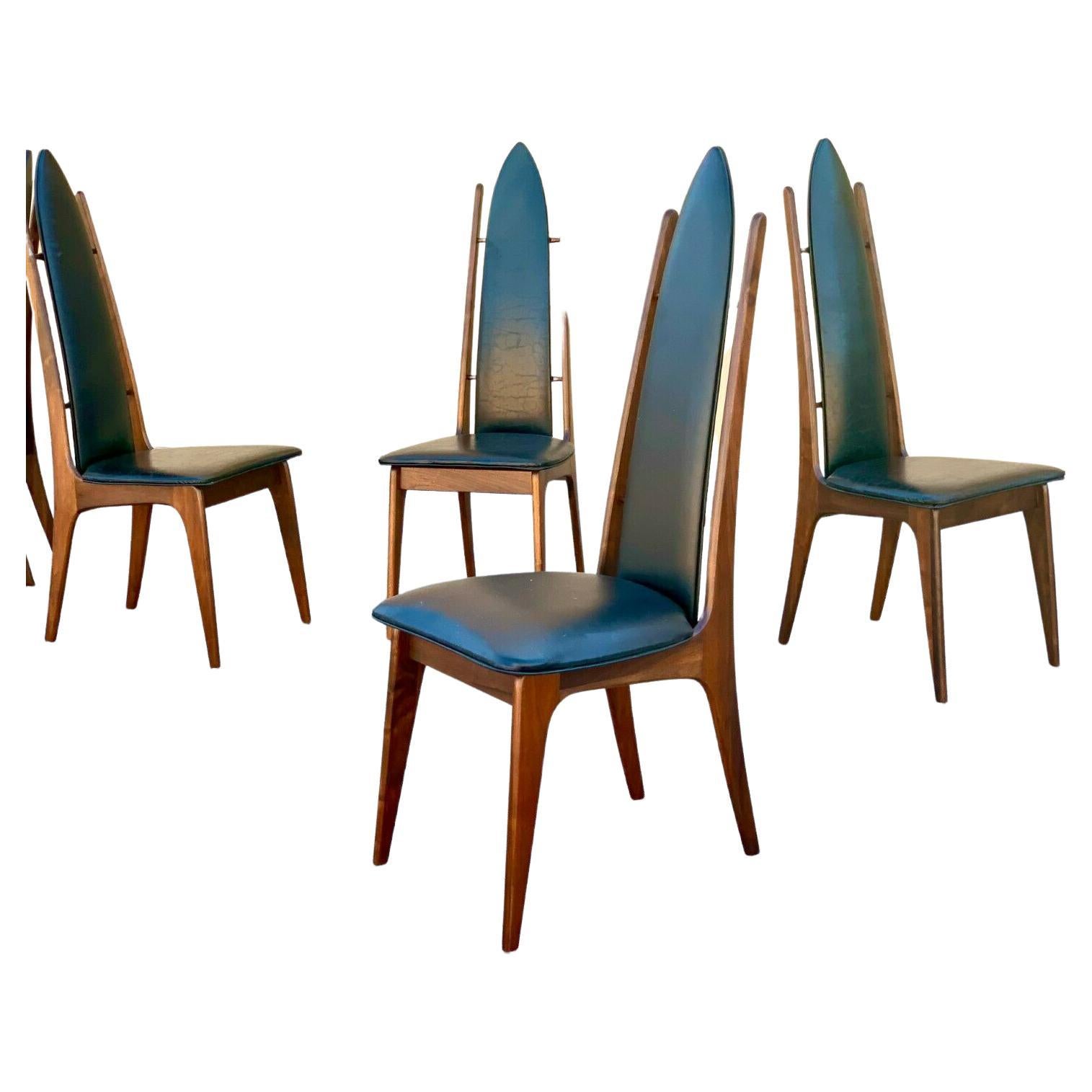 Set of 6 Mid Century high back dining chairs Attributed to Adrian Pearsall

Beautiful set of 6 midcentury dining chairs in Attributed to Adrian Pearsall. High arched backs along with splayed legs give these chairs an interesting visual profile.