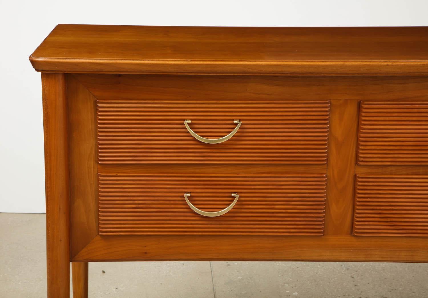 Walnut sideboard with ribbed drawer faces and brass pulls. A fantastic and restrained Buffa design. Wood has recently been refinished and brass has been polished.