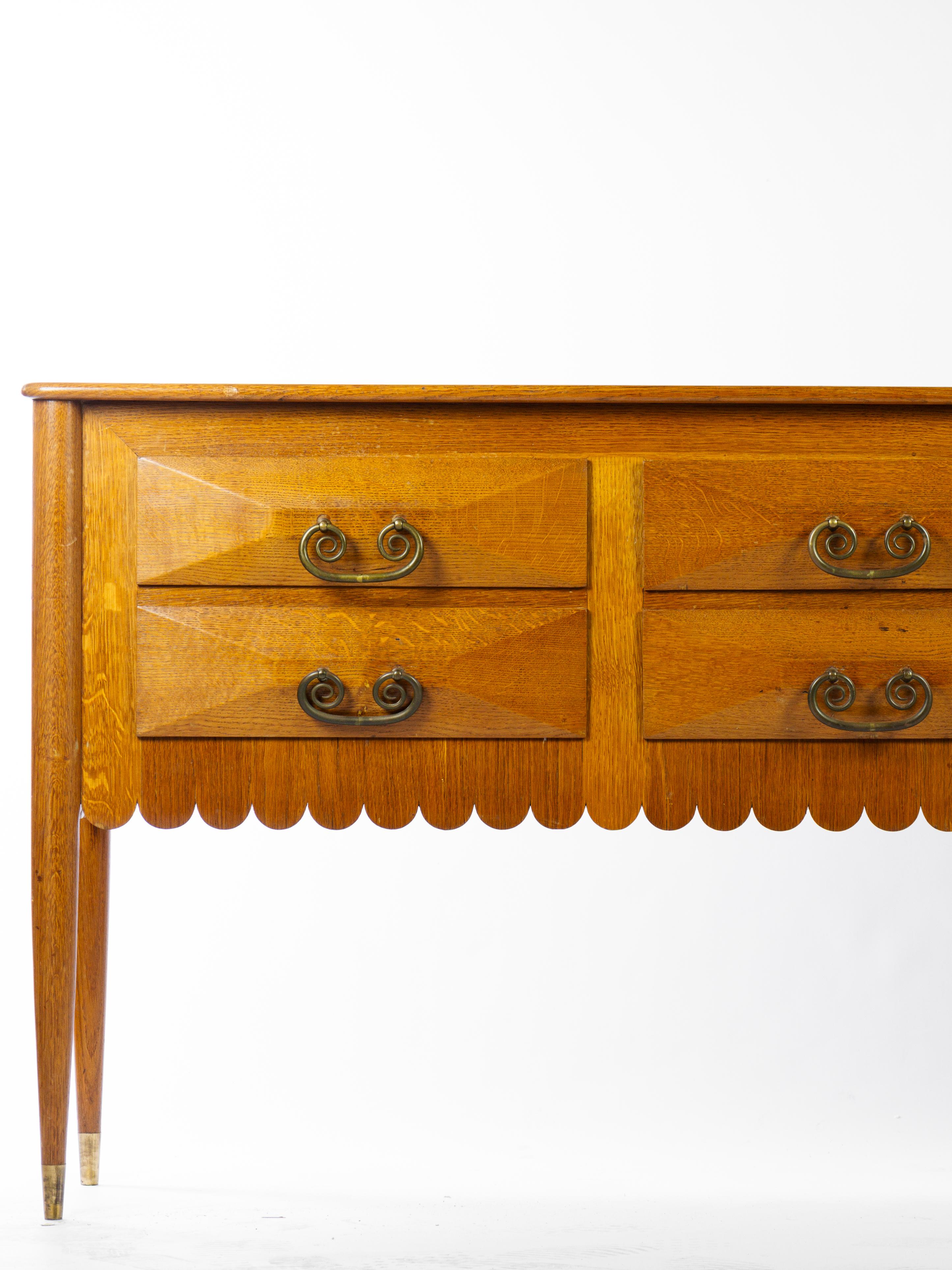Important 6 drawers commode designed by Paolo Buffa. 

Golden oakwood, bronze handles, brass feet. 

Italian work circa 1950

Hight feet and rounded notch under the deck. 

More information on request. 