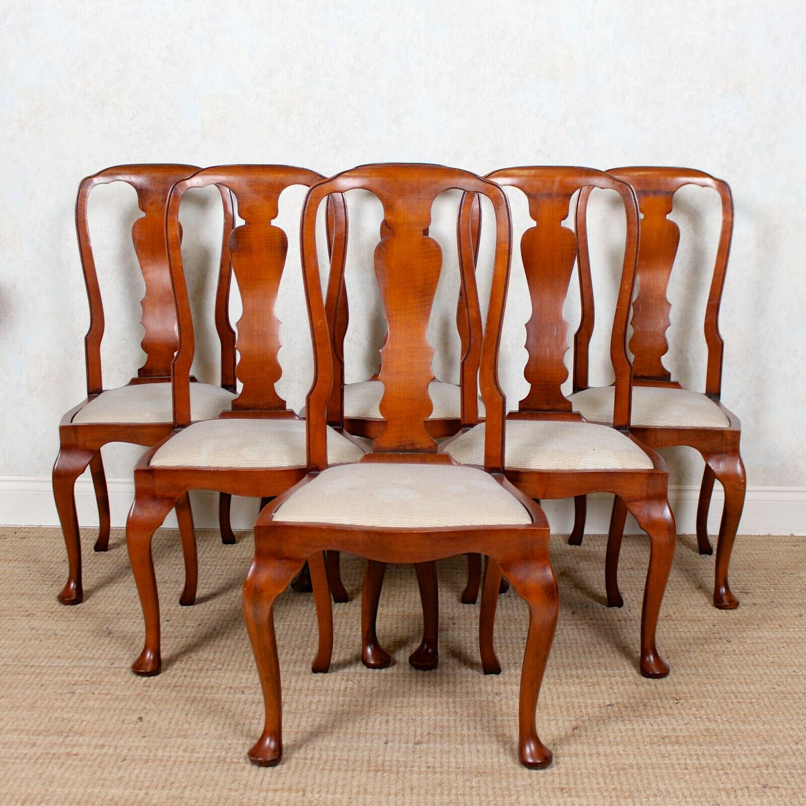 A fine quality set of dining chairs in the Queen Anne manner.

Constructed from solid mahogany boasting a rich patina.

The curved top rails and well carved vasiform splats above drop in seats raised on carved apron, cabriole legs and pad