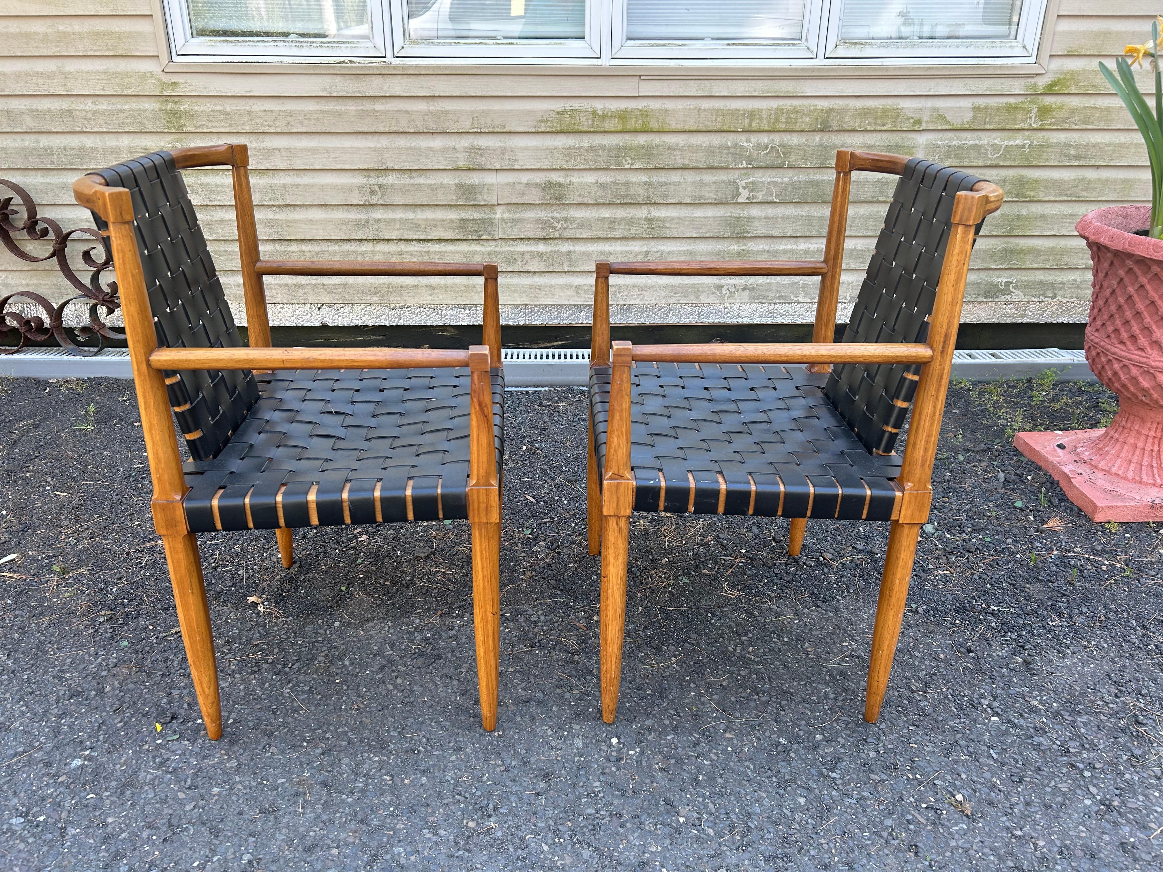 Hard to find set of 6 dining chairs from the Tomlinson “Sophisticate Line” model no 61 dated 1958. Includes 4 side chairs and two armchairs. Pecan hardwood frame with woven black leather straps at seats and backs. This was a limited production