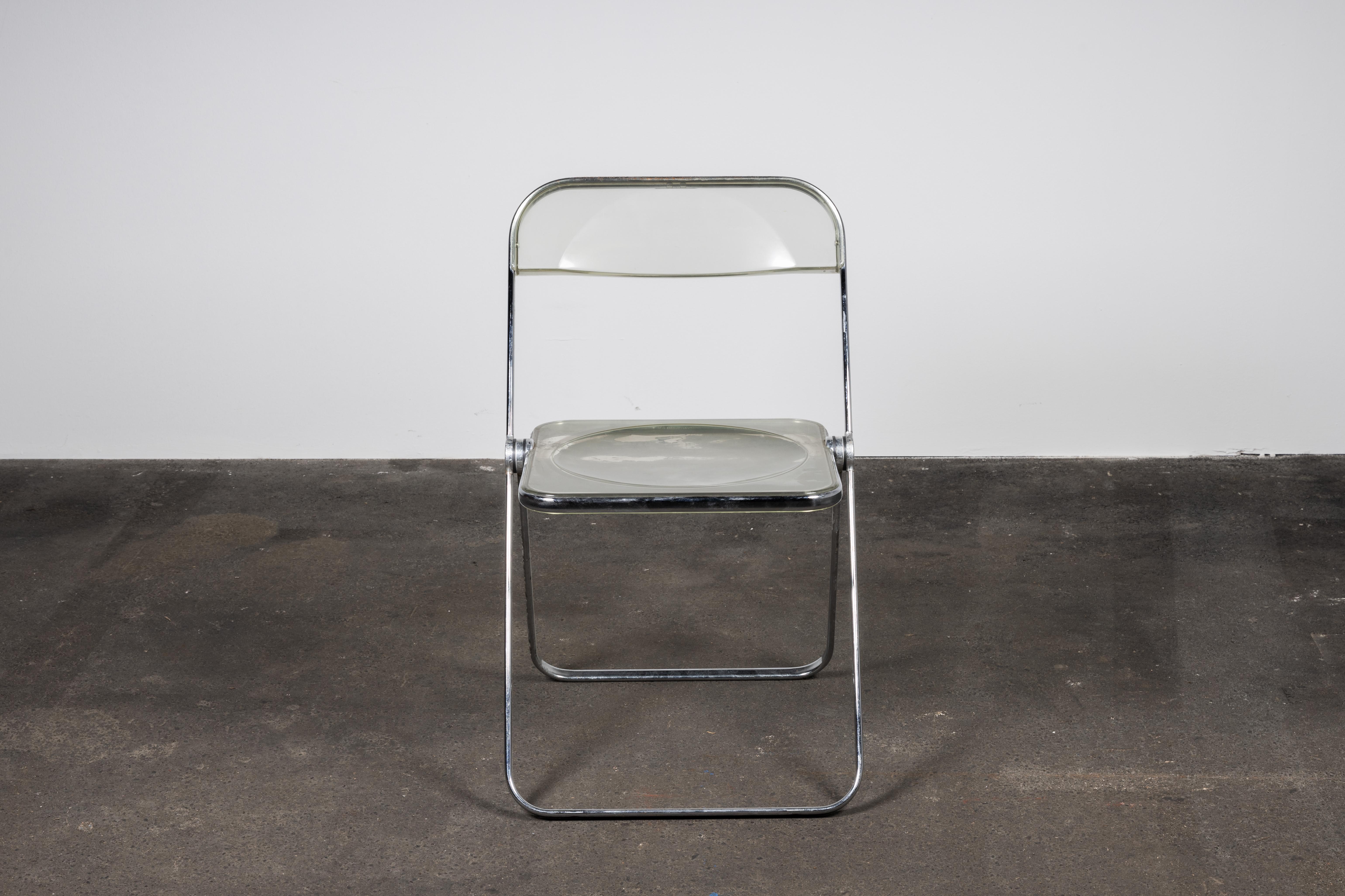 Six Space Age chrome and transparent Lucite folding chairs designed by Giancarlo Piretti for Castelli, Italy. 

With steel frame, seat and back in clear Lucite, it represents the realization of “democratic design” and is exhibited at the MoMa