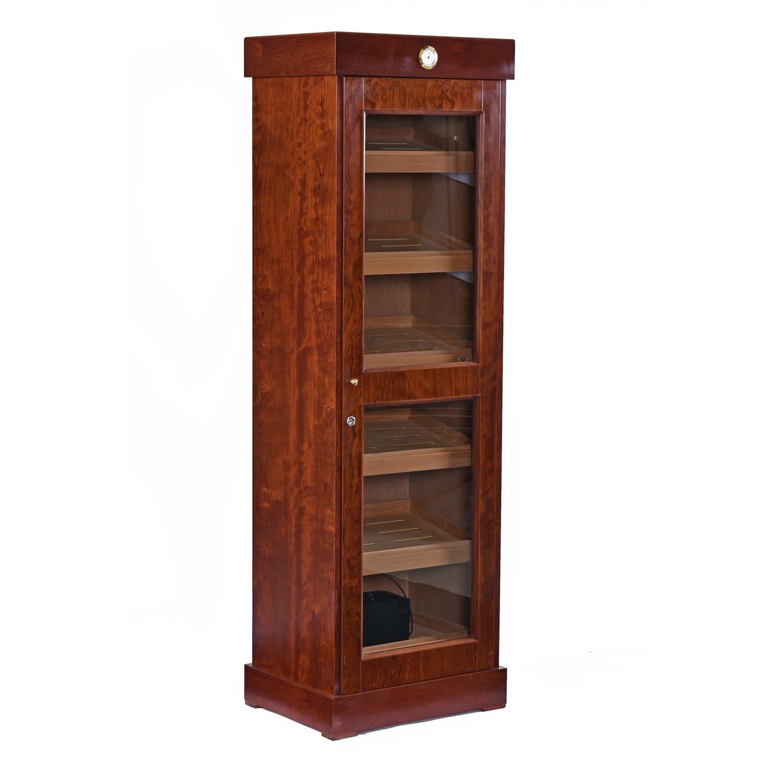 This 6 feet plus tall Cabinet cigar humidor holds up to 3,000 cigars. It combines old world craftsmanship with rare African Bubinga heartwood and virgin Spanish cedar. The Rosewood exterior is made with African Bubinga heartwood, an exotic and