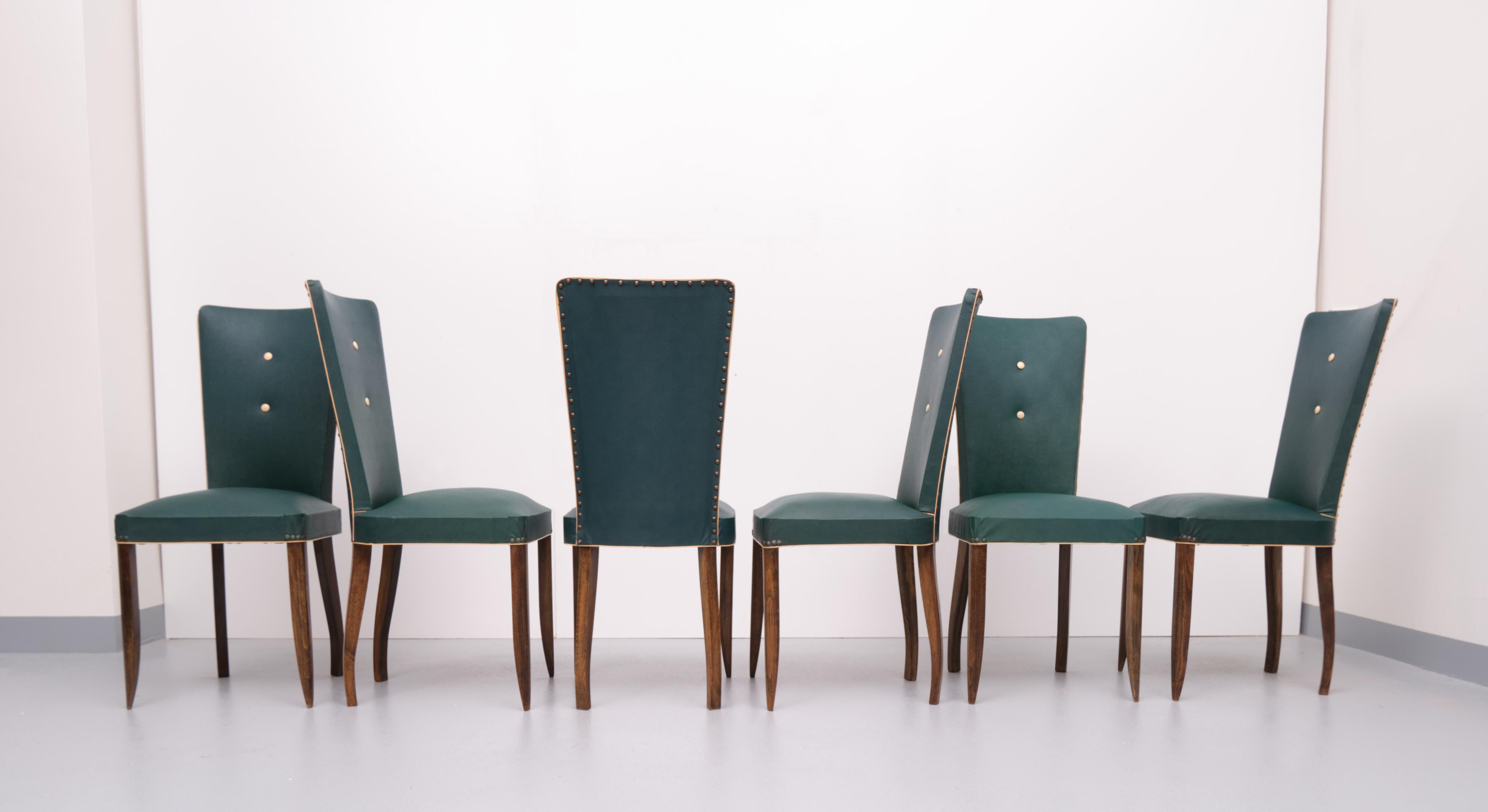 6 stunning French Art Deco dining chairs. In there original dark green faux leather upholstery.
Maple wood legs. Good condition. Very nice and elegant dining chairs.