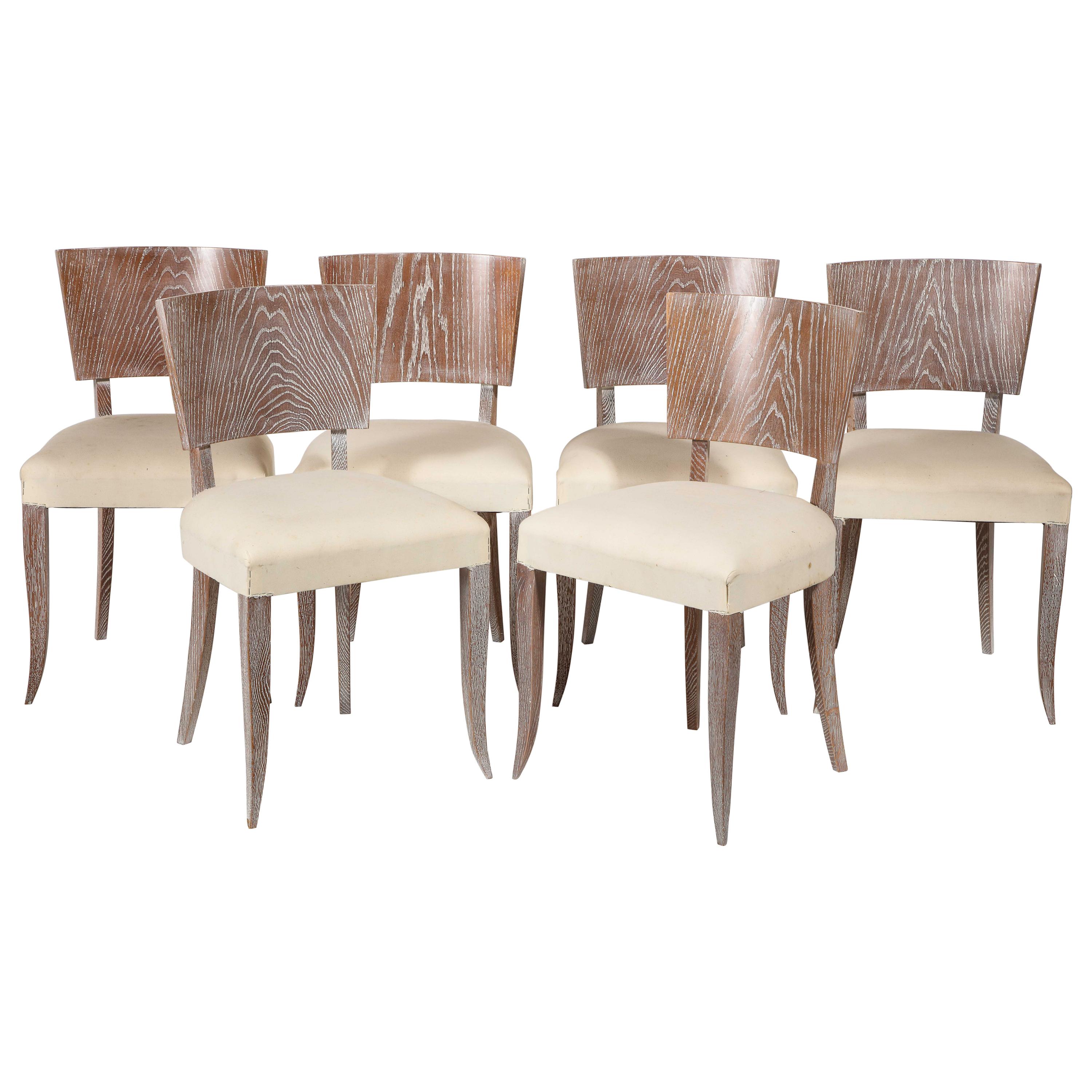 6 French midcentury cerused dining chairs, 1930s

Beautiful oak Art Deco French dining chairs, in lovely condition. The wood is beautifully cerused. The seats could do with being upholstered.
Jean Michel Frank inspired.