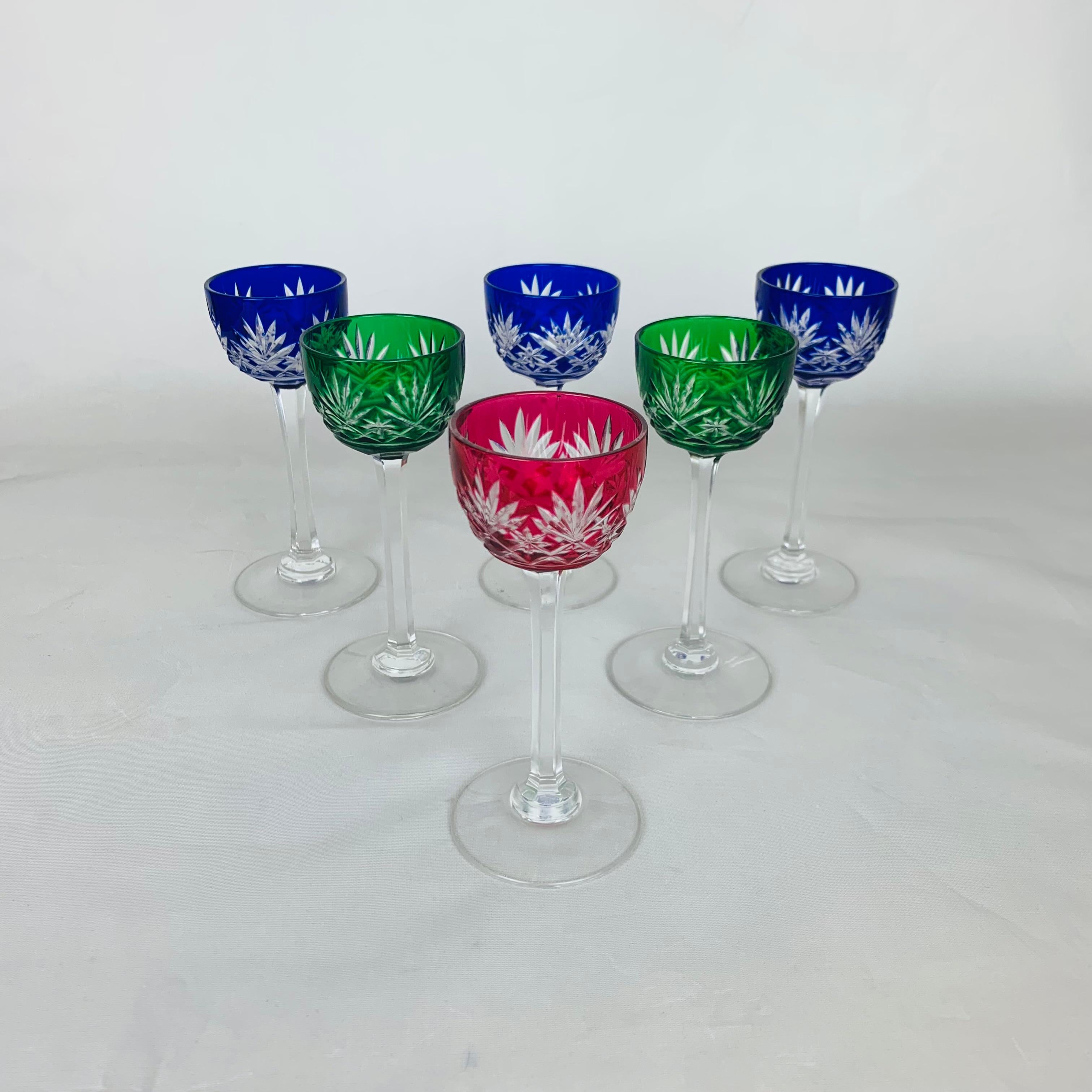 Beautiful and rare set of six colorful art deco liquor glasses, manufactured by the prestigious French crystal Factory Saint Louis during the 1930's. The technique used is cut crystal on a double color layer. They're in very good condition. There