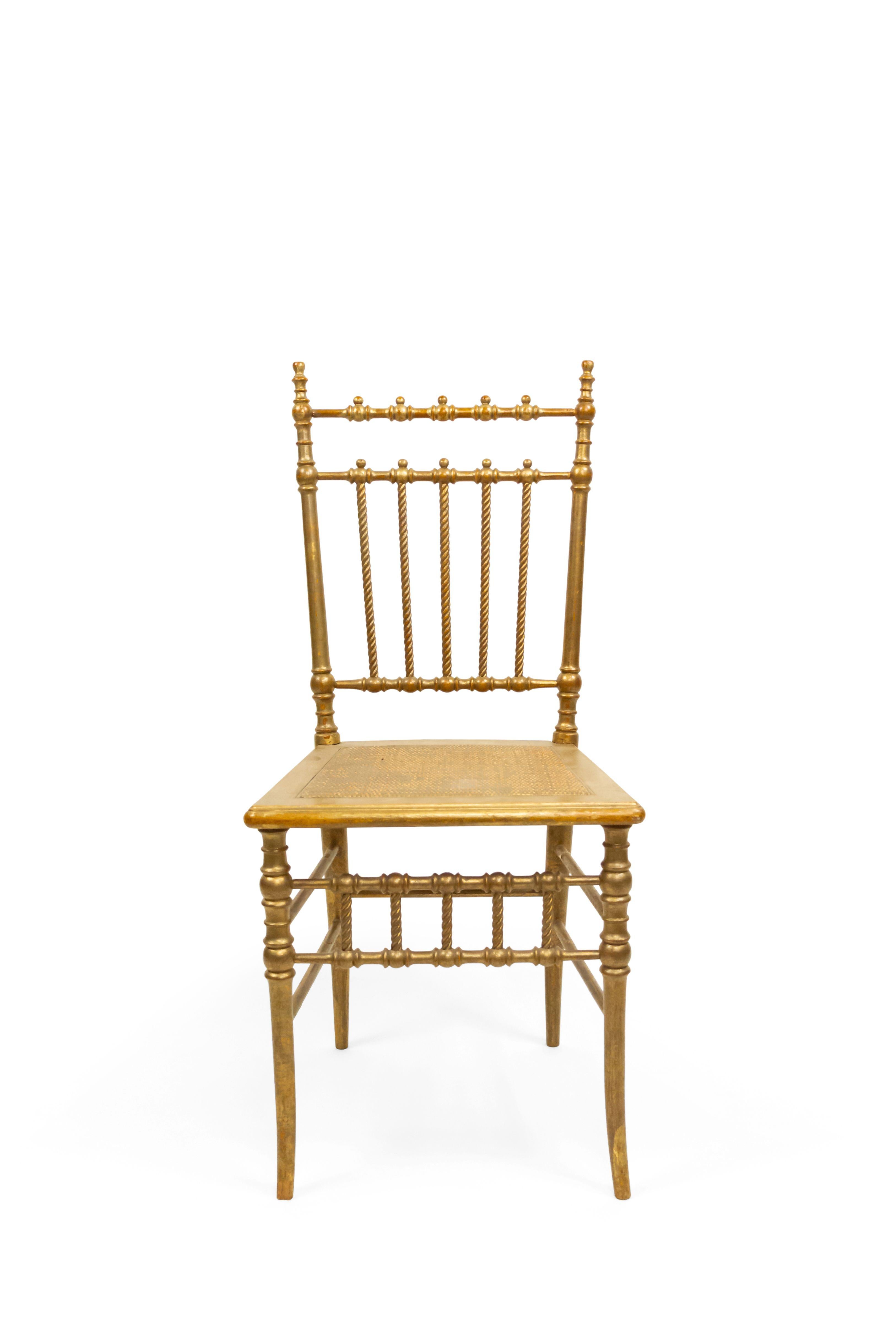 6 French Victorian style gilt ballroom side chairs with spindle and ball back and rope design slats with woven seat (PRICED EACH) (20th Cent.)

There is a split in one of the leg supports.