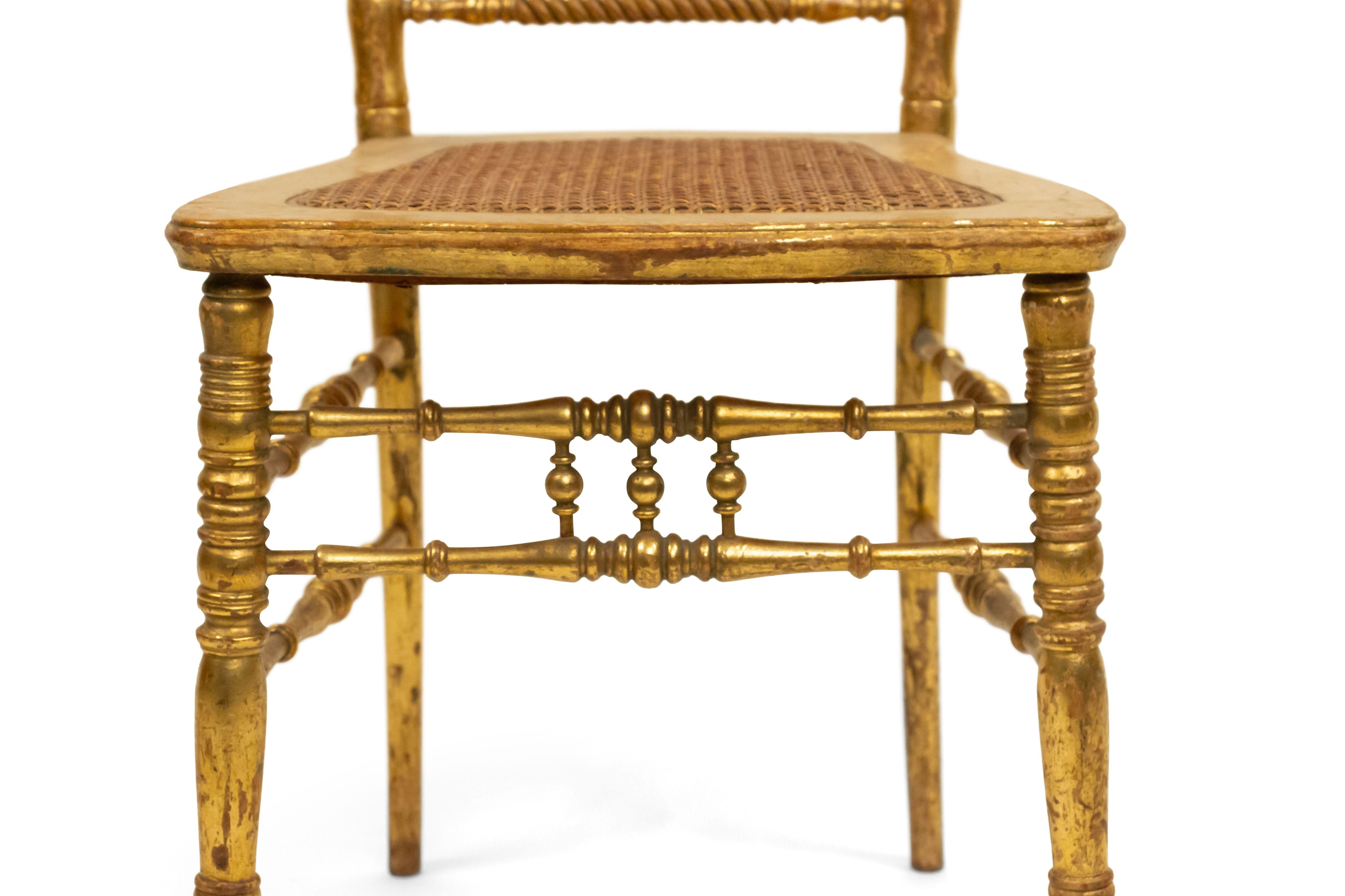 6 French Victorian style (mid-20th Century) gilt ballroom style side chairs with spindle back and twisted top rail with cane seat (PRICED EACH)