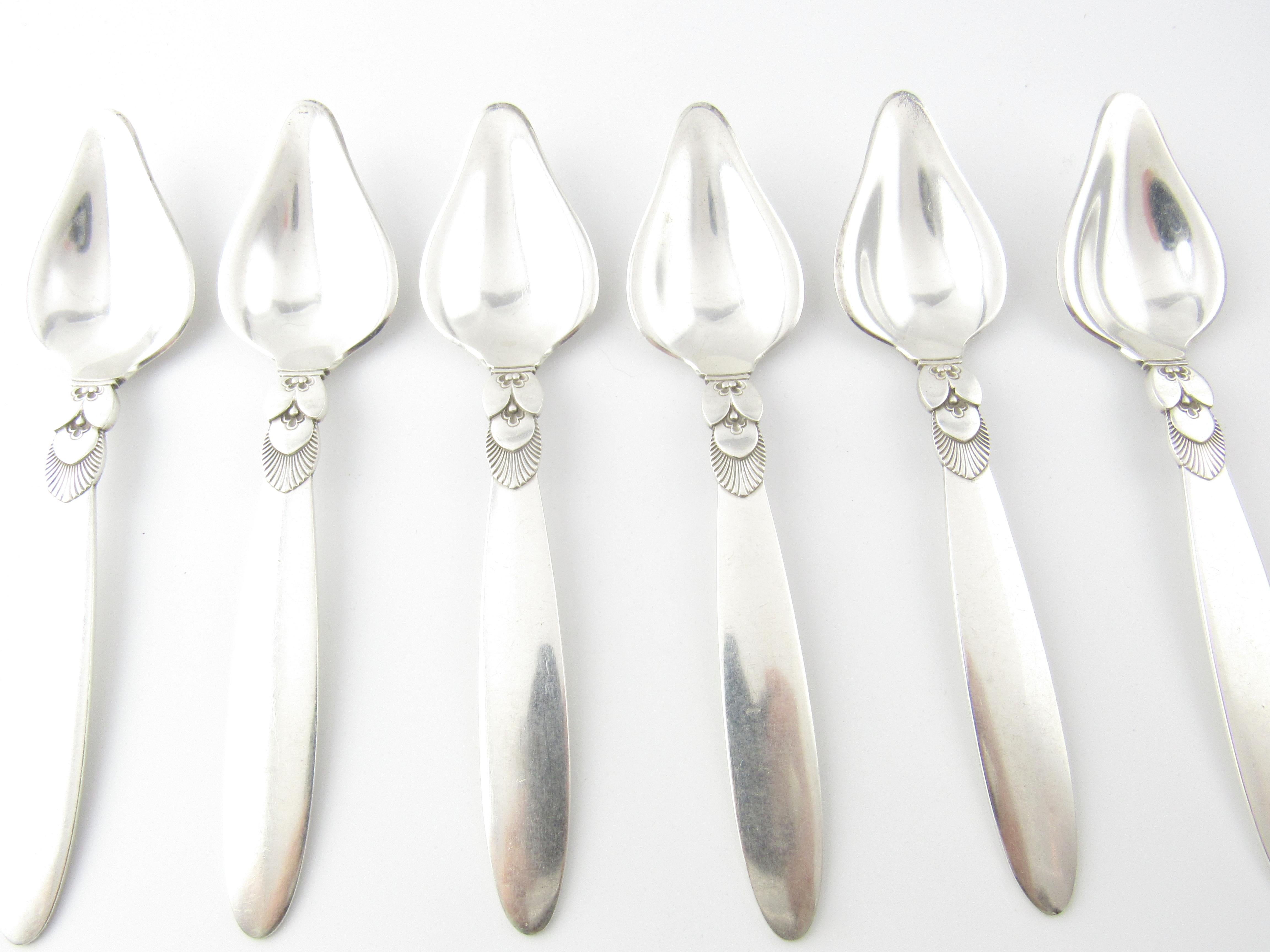 6 Georg Jensen Cactus Sterling Silver Triangular Fruit Spoons #075

This is a very lovely and detailed set of 6 Cactus sterling silver triangular fruit spoons designed by Georg Jensen.

Measurement: Measure 6 inches in length and 1 6/16 inches in