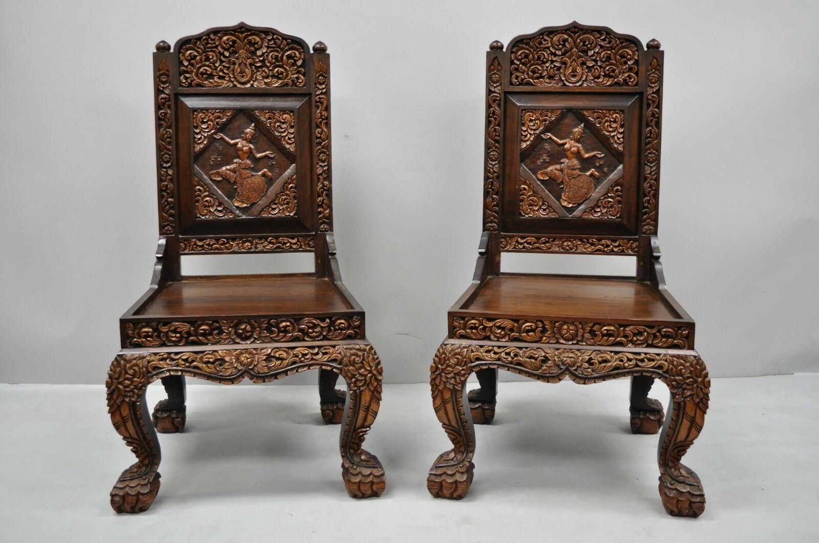 6 hand carved Thai teak wood dining chairs with dancing female. Listing features ornately carved wood throughout, dancing Thai woman to backrest, carved paw feet, finely carved backs, solid wood construction, great style and form, seat cushions to