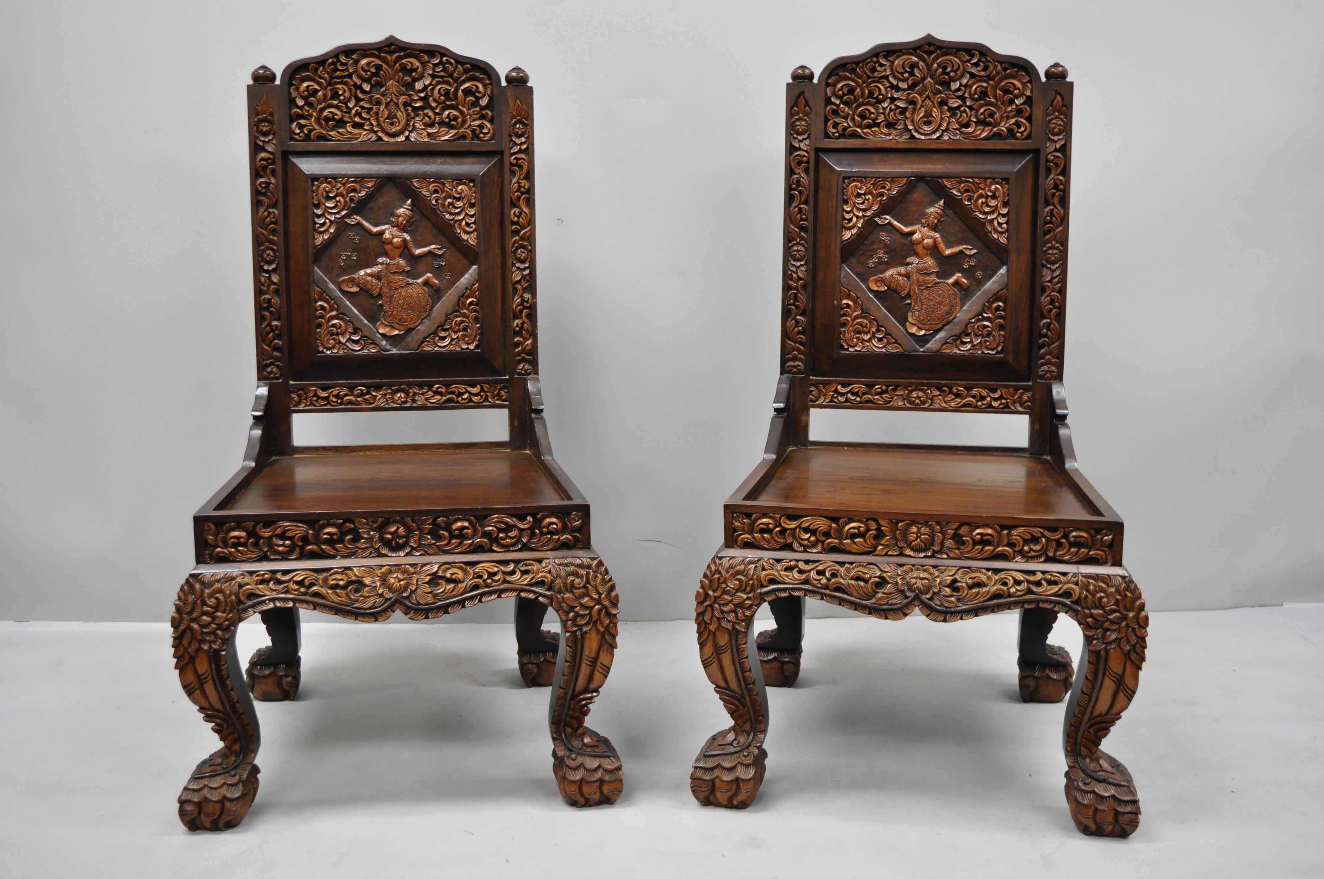 6 hand carved Thai oriental teak wood dining chairs with dancing female. Listing includes ornately carved throughout, dancing Thai woman to backrest, carved paw feet, finely carved backs, solid wood construction, great style and form, and seat