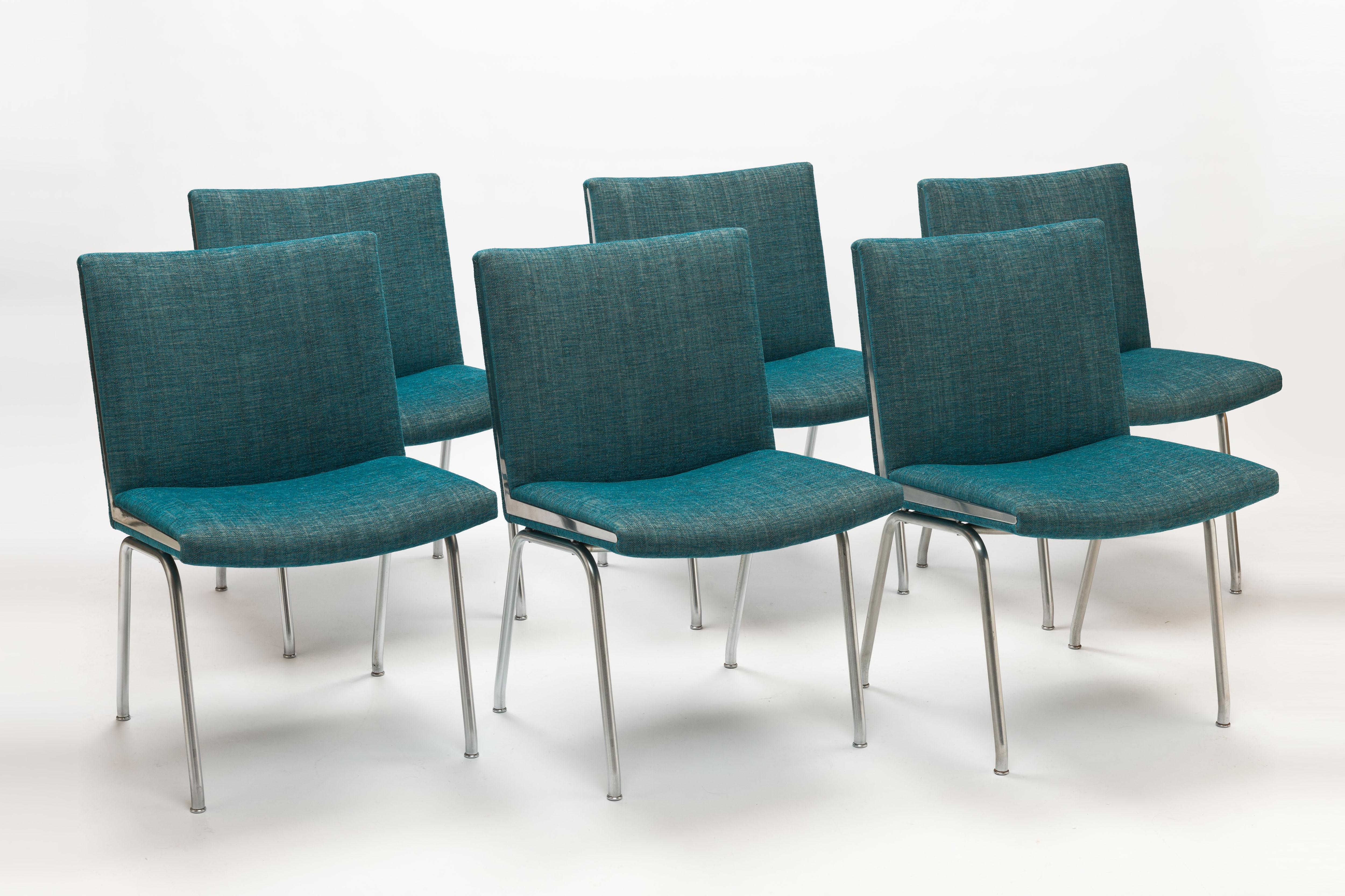 Set of 6 Hans Wegner AP38 'Airport' Chairs by A.P. Stolen, Denmark. Exceptional modern designed chairs on steel frames with sharp triangle shape chrome-plated steel details on both sides of each seat. Designed in 1959. Seats and interiors are fully