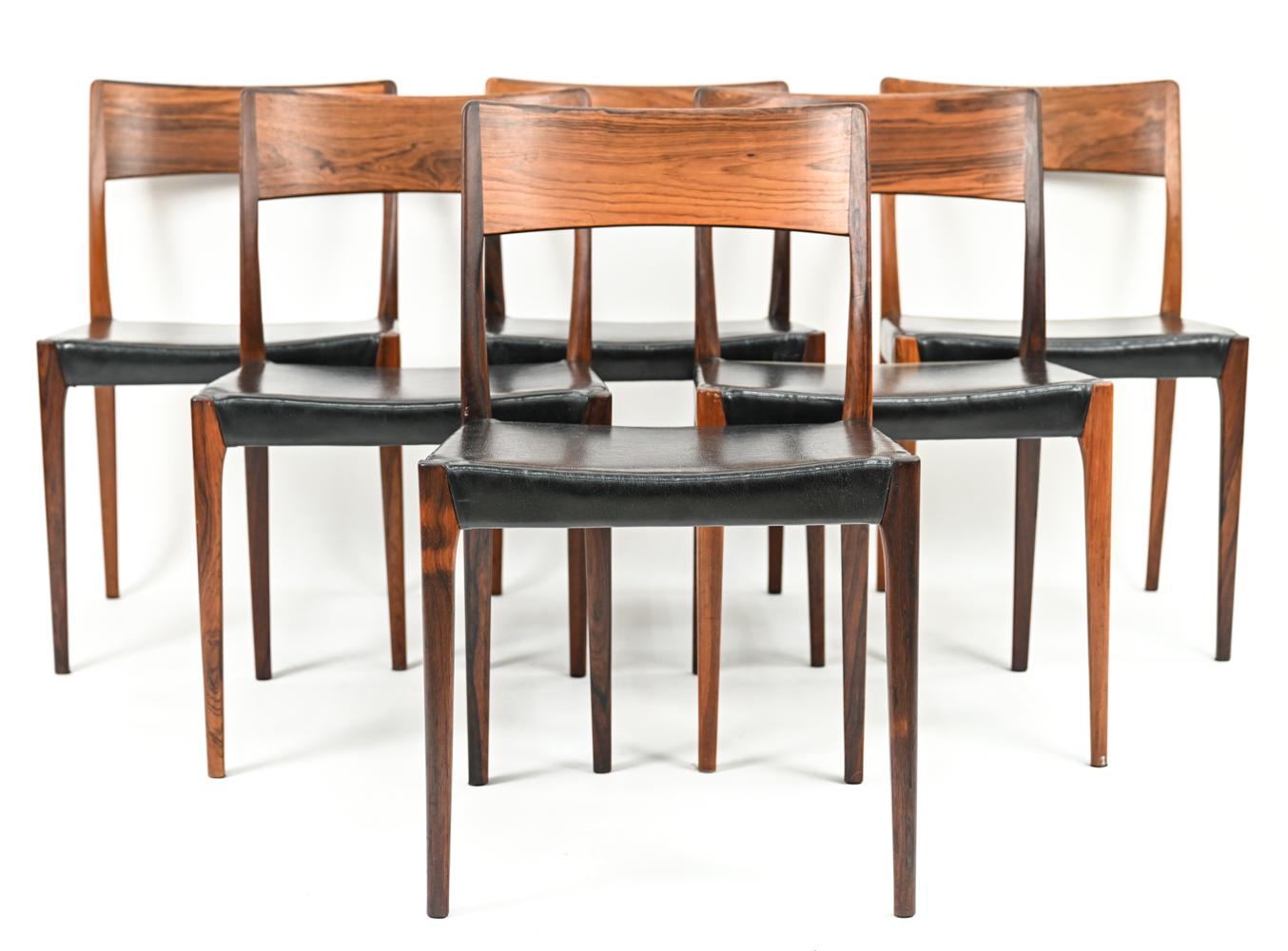 A stunning set of Scandinavian modern dining chairs by Hornslet Mobelfabrik with gorgeous sculptural rosewood frames and black leatherette upholstery, c. 1960's.
Stamped underneath: Hornslet Mobelfabrik.