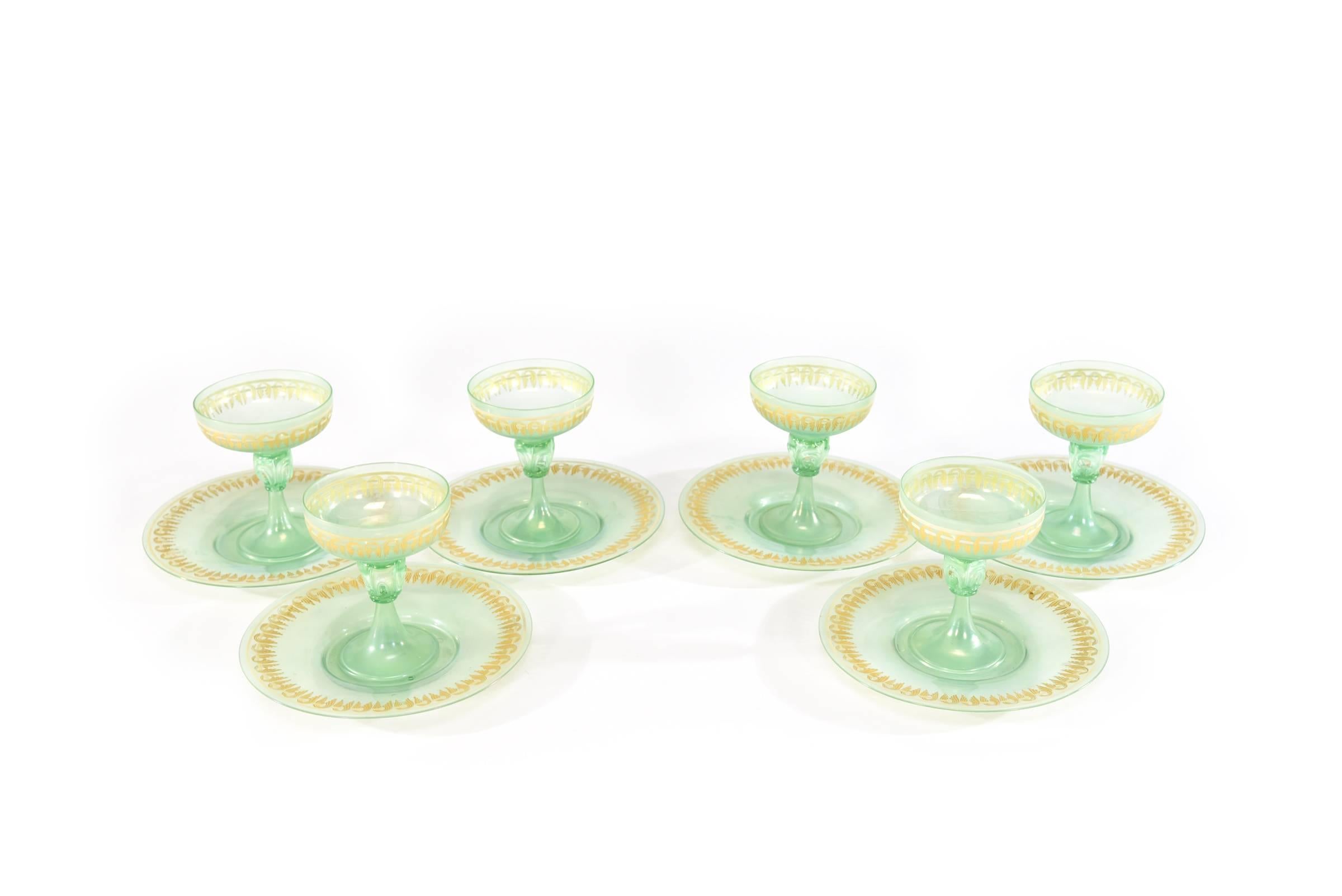 This set of 6 handblown Venetian compotes are shaped with an elegant profile and decorated in soft green with gold highlights. The matching under plate make for a lovely presentation and very versatile. First course, intermezzo and wonderful for