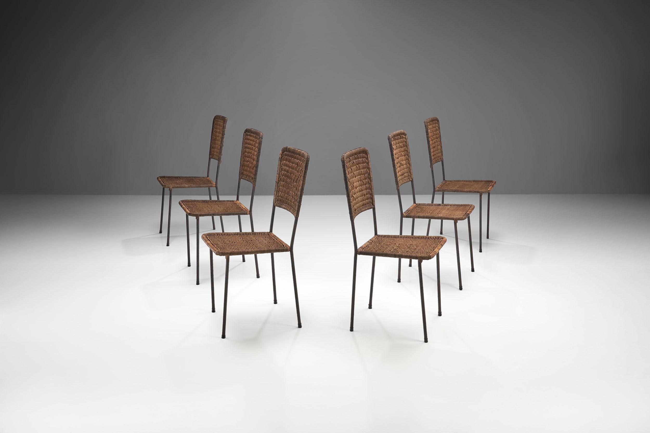 These six Brazilian chairs in iron and rattan, that resemble the work of designers Hauner and Eisler, have a modest and very modernist design that is as elemental as they come. The clear and open frame is balanced geometrically with the solid