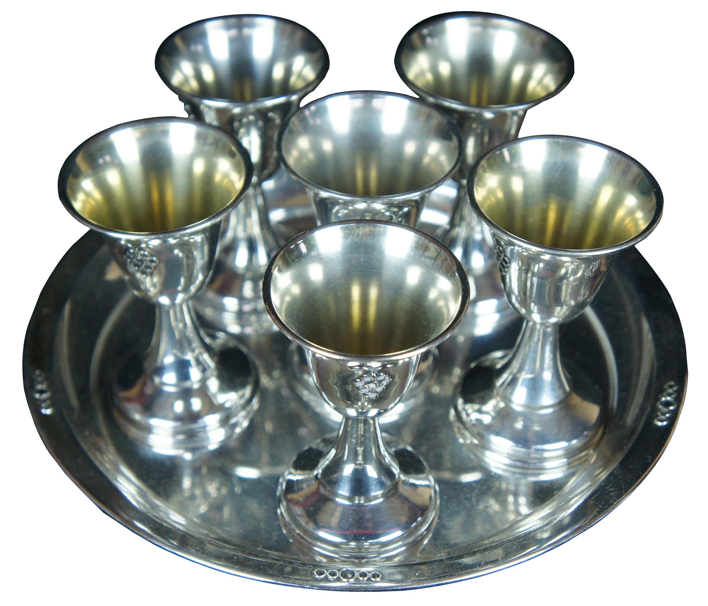 Vintage Dugma Israeli silver plated kiddish cups and tray featuring etched grape design. Made in Israel. Marked on each piece.

Cups 3 1/8