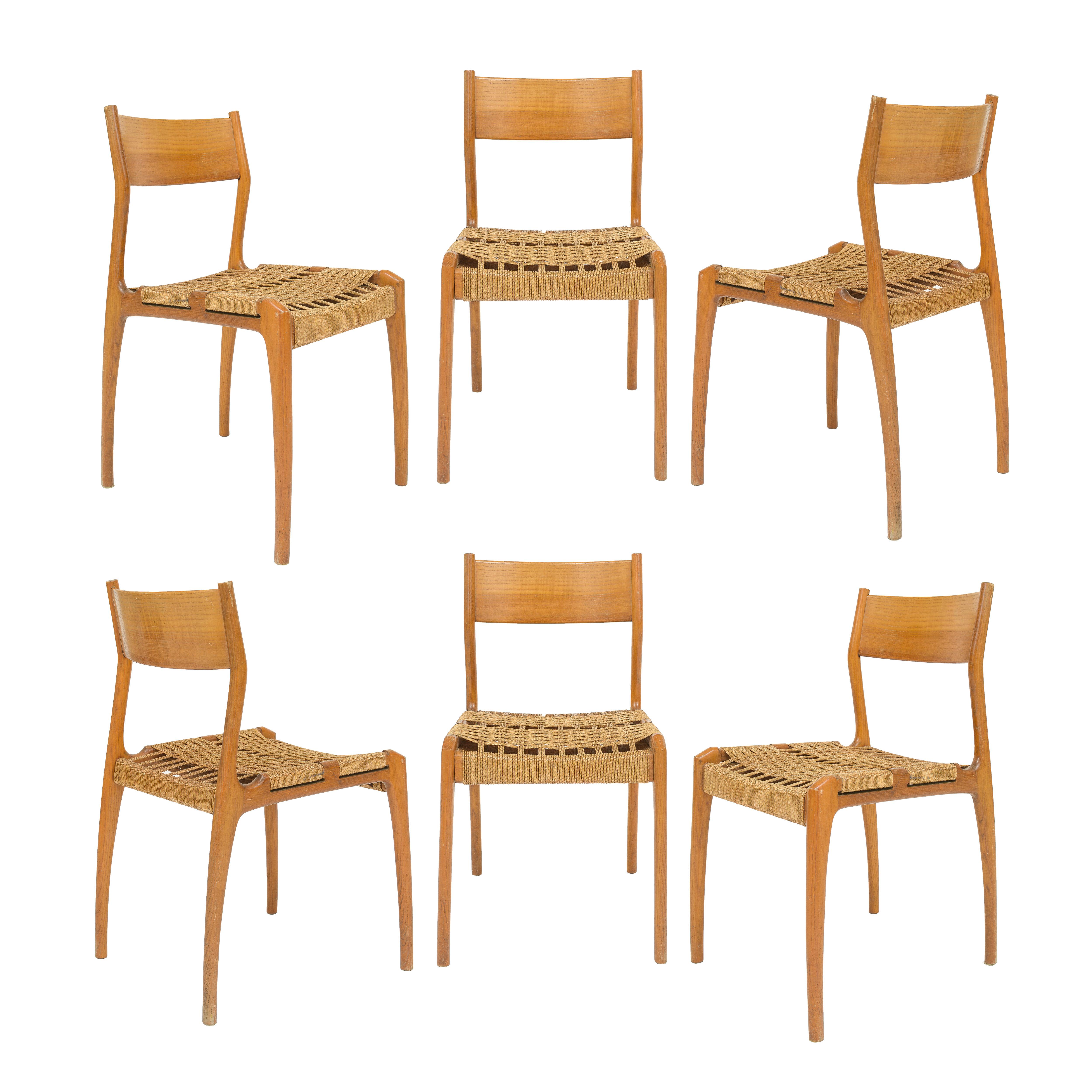 6 dining chairs imported from France. Beautiful condition. Rush seating and wood in excellent condition. Made in 1960's.
