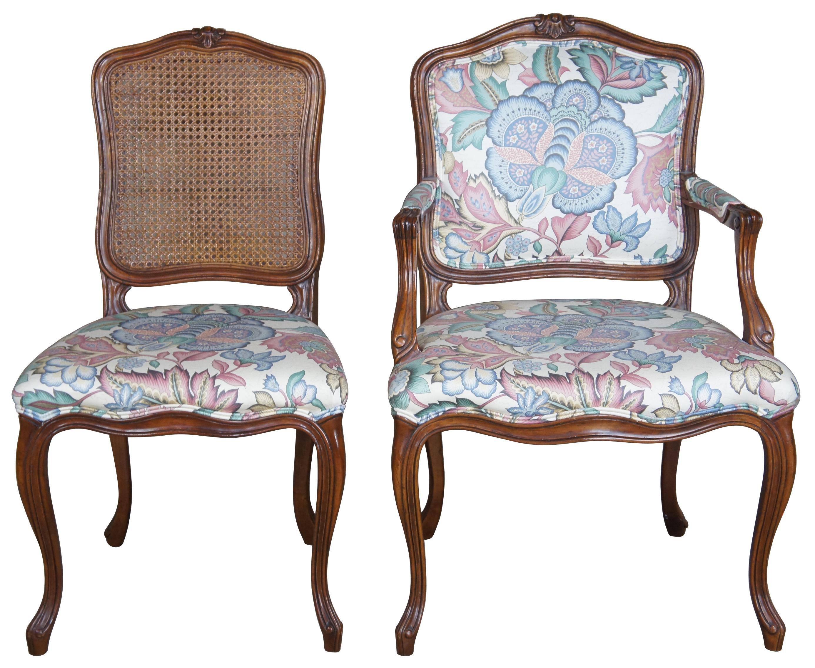 John Widdicomb dining chairs, Circa 1980s. Made from walnut with a cane back and floral upholstered seat over cabriole legs. Arm chairs feature a fully upholstered back. Draws inspiration from Louis XV and French Country / Provincial Styling. John