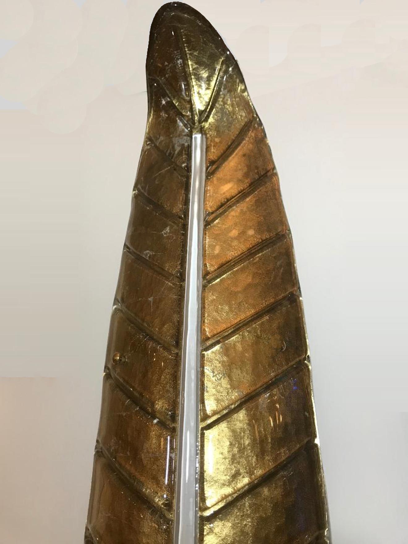 6  large palm leaf form Murano glass wall light
Gilded glass
Spectacular warm beam of light


 
 