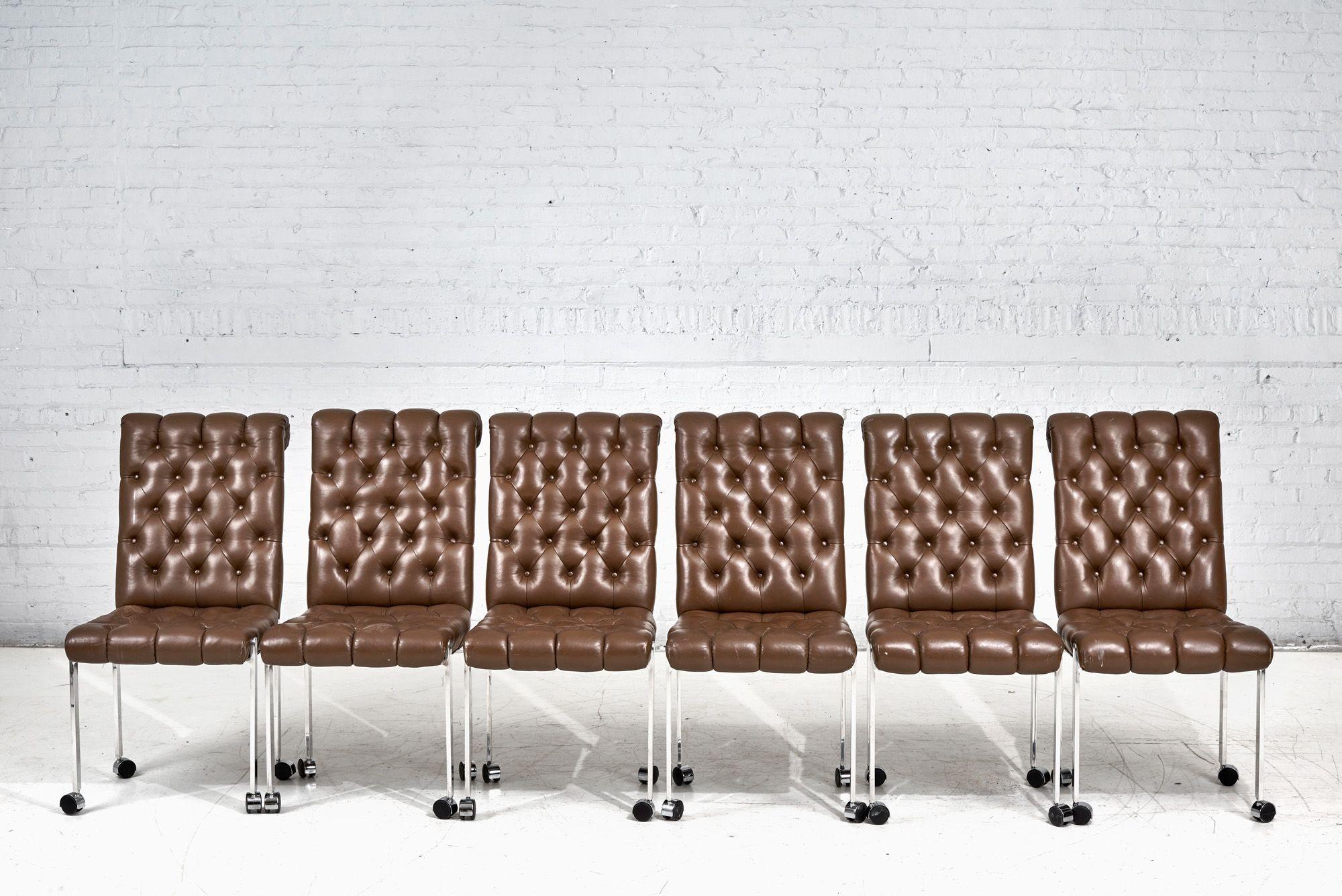 6 Leather tufted dining chairs on casters, 1970. Original leather with great patina.
