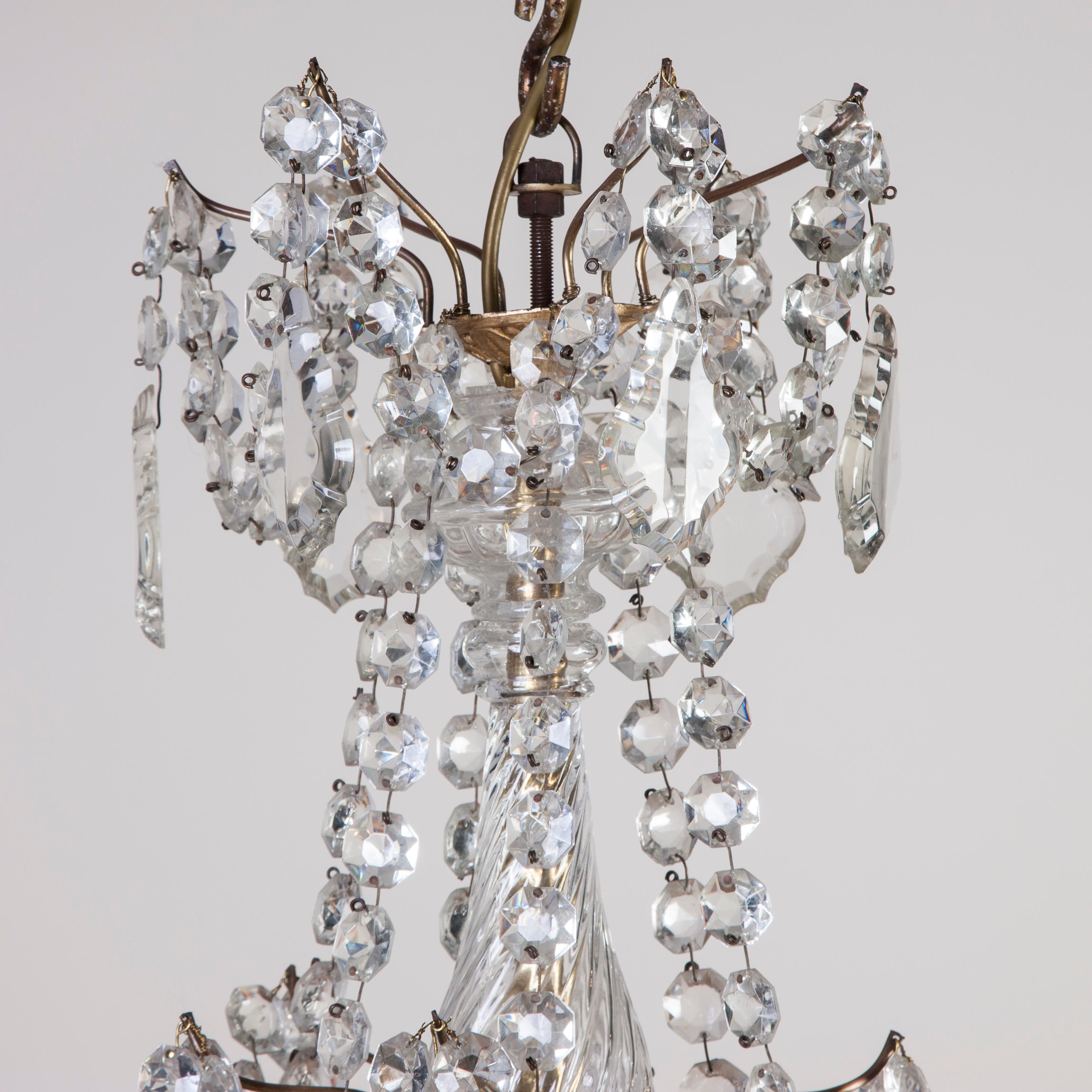 A late Victorian 6-light crystal and ormolu chandelier.

Weight: 9 kilos (20 lbs).