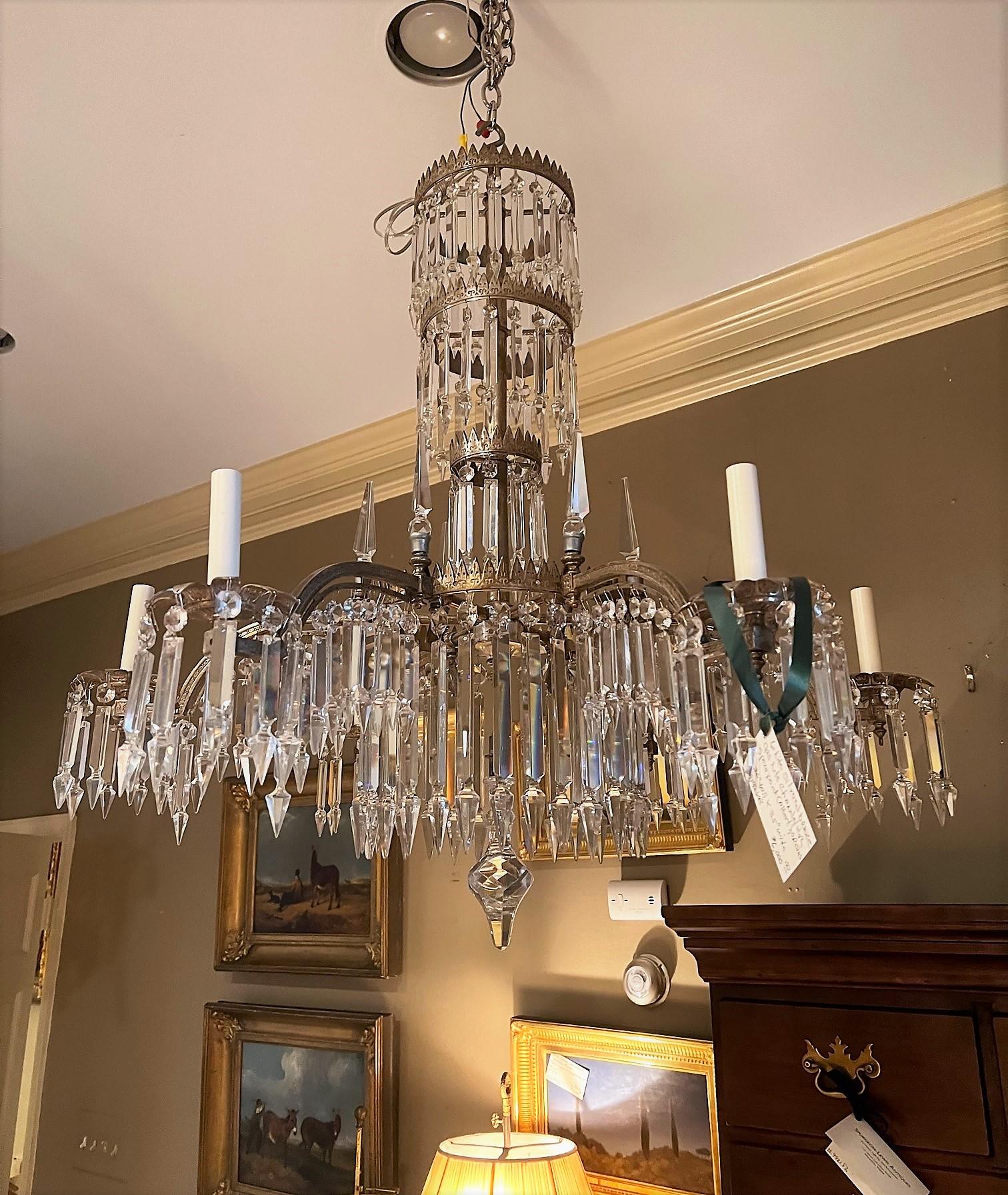 This exceptional and stunning chandelier was originally fitted for gas in a very fashionable home of the mid-Victorian era. The extraordinary design was inspired by the decorative motifs of ancient Babylon. In the early 20th Century the fixture was