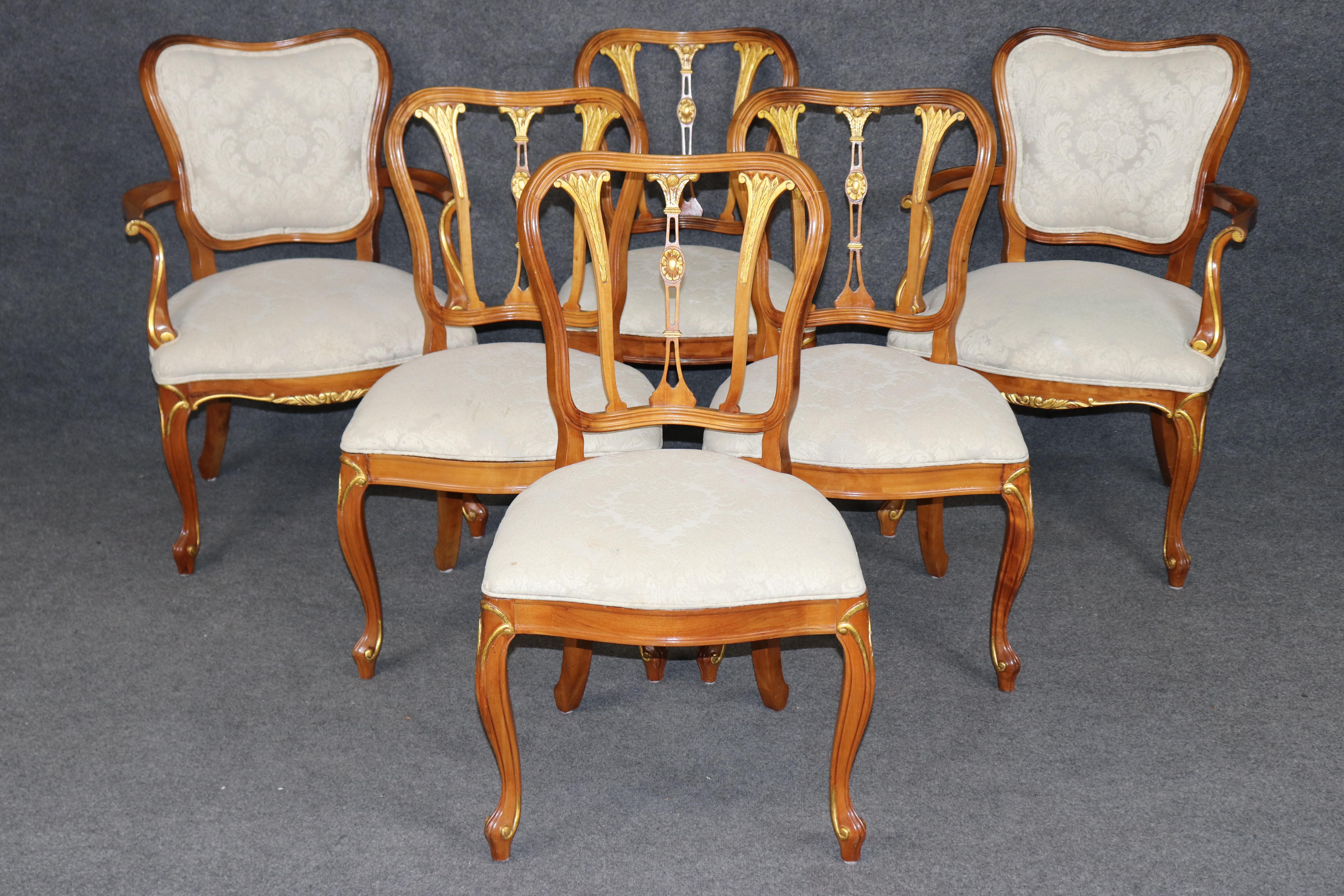 Dimensions - H: 38 1/4 in W: 25 3/4 in D: 27 1/2 in SH: 19 3/4 in 

An exceptional set of six Louis XV style carved walnut dining chairs, finely crafted with the elegance and artistry reminiscent of the Rococo revival period. This sophisticated