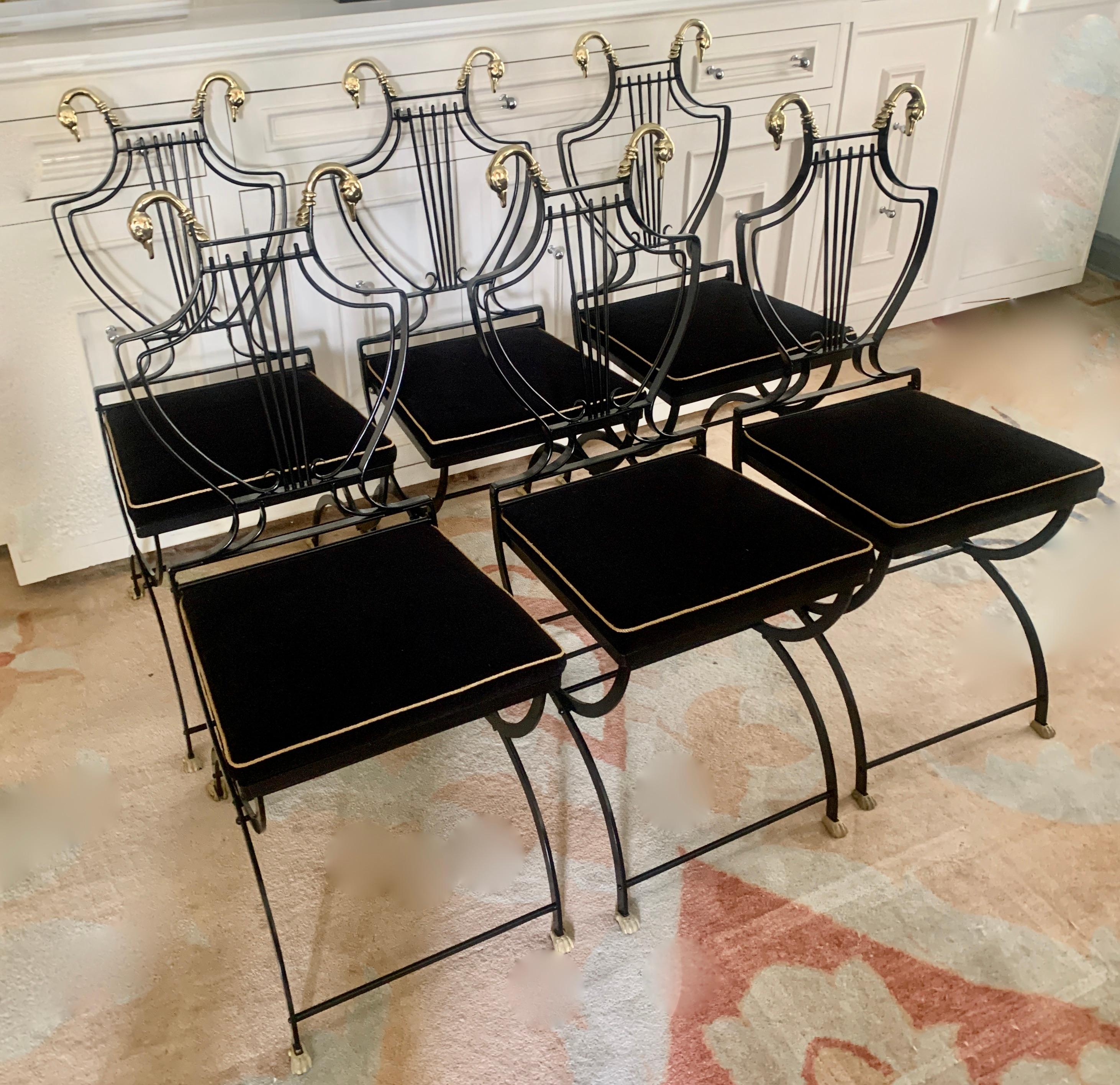 Set of six Maison Jansen folding chairs. The set are all newly powder coated black, with freshly polished brass swan and Lyre backs and brass claw feet. Newly upholstery in black Belgian Velvet with micro gold rope gimp. 

The set are a compliment