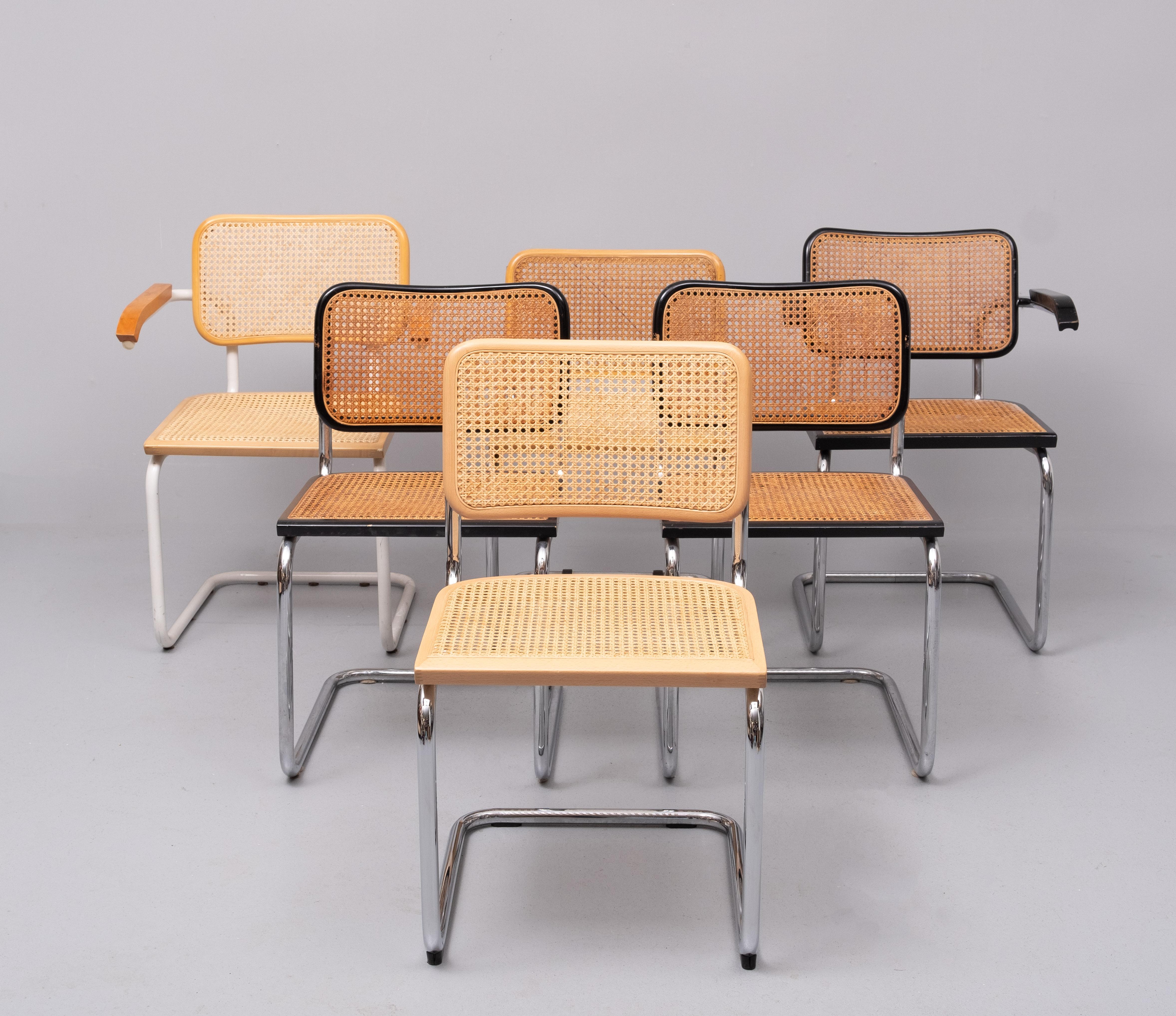 For sale 6 Marcel Breuer cantilever chairs ,2 Armchairs one signed 
4 without armrests . one signed Fasem . Its a bit off a mismatch , 
Looking nice .3 Black 3 Natural.   one of the Black chairs have a little damage , see photos  . 1970s  