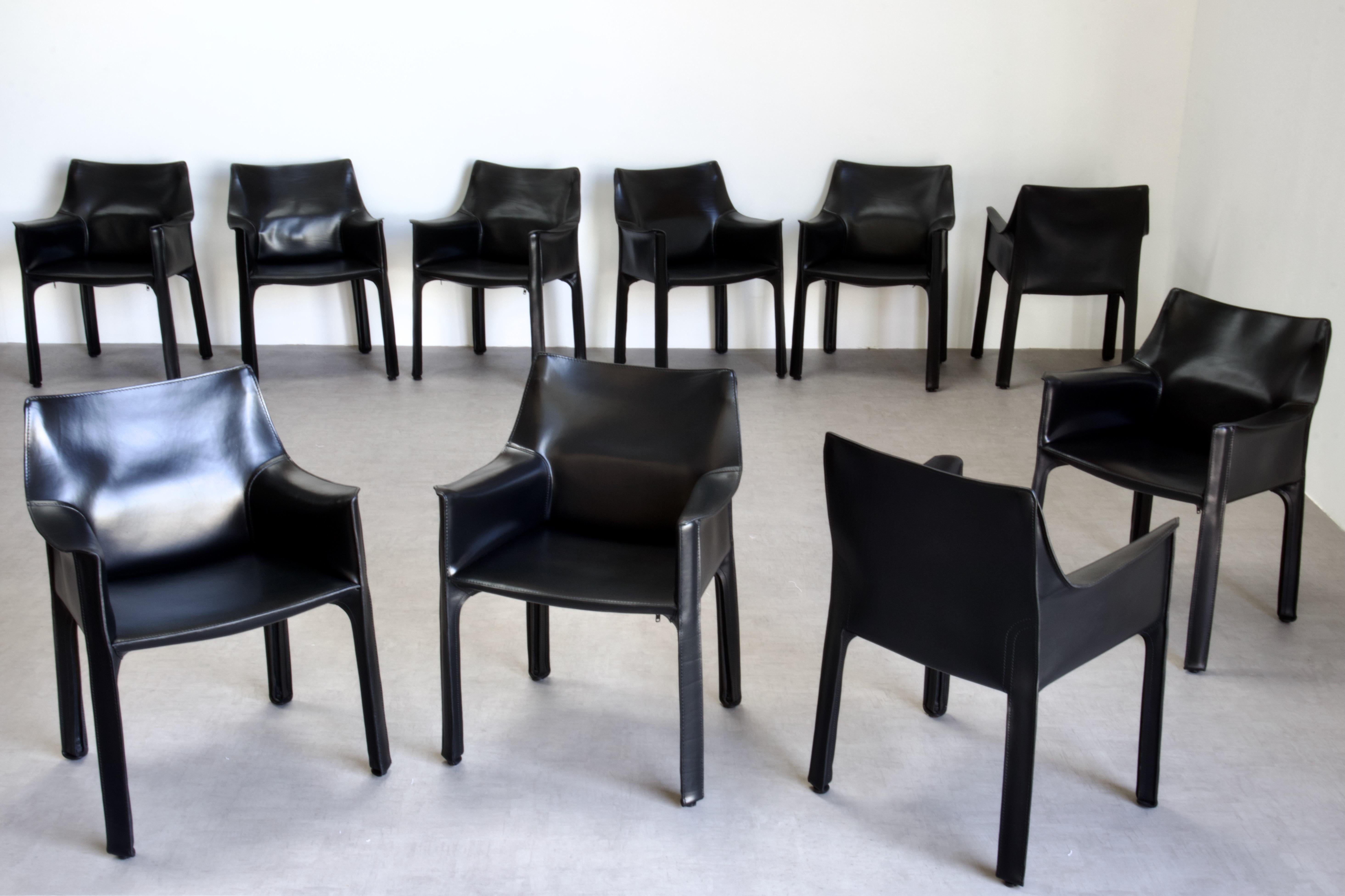 Set of 6 Mario Bellini CAB 413 chairs, made by Cassina. Flexible steel frame covered with a skin of high quality vintage black saddle leather. 

The chairs, which were already in very good condition, have been thoroughly refreshed by our atelier and