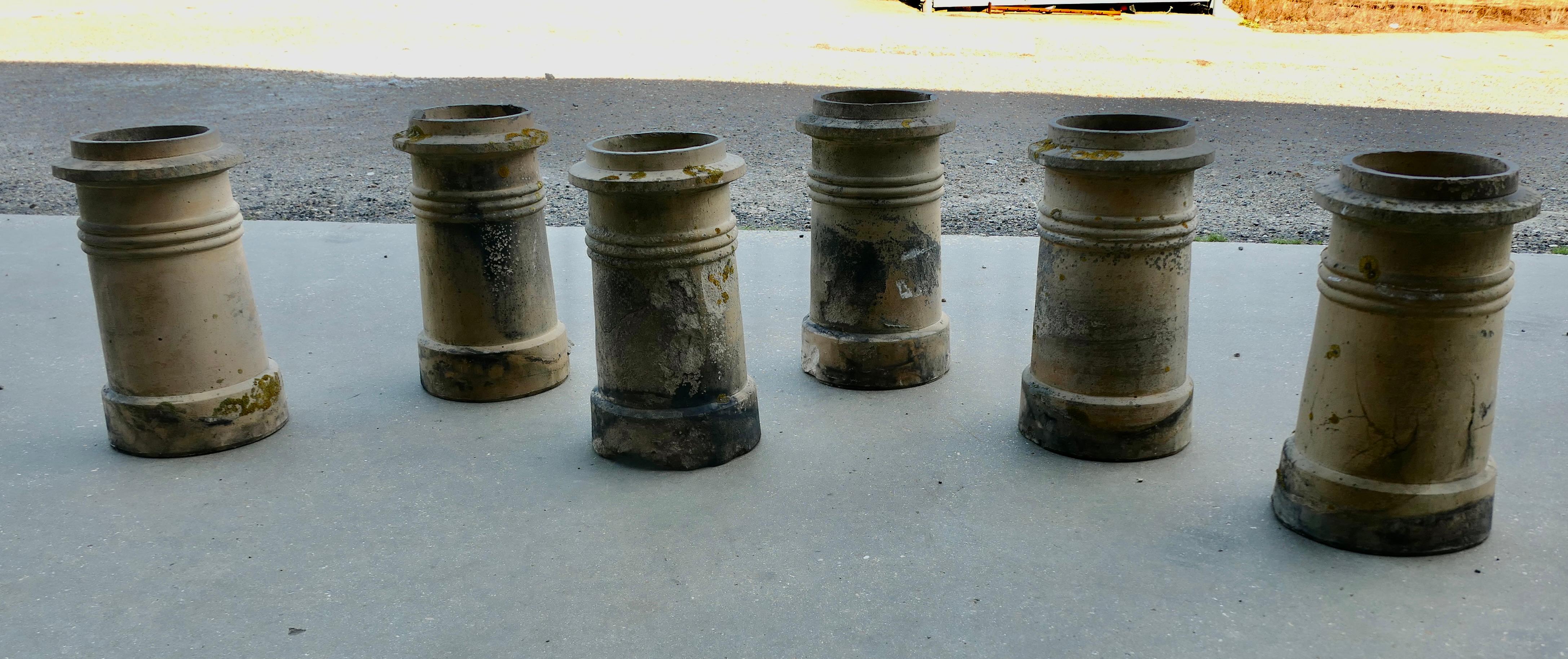 6 Matching Victorian Chimney Pots 

Well used and well weathered, a good matching set for excellent continuity, this set would work very well along a path or set on steps, they are in varying used conditions as shown in the pictures, sound and