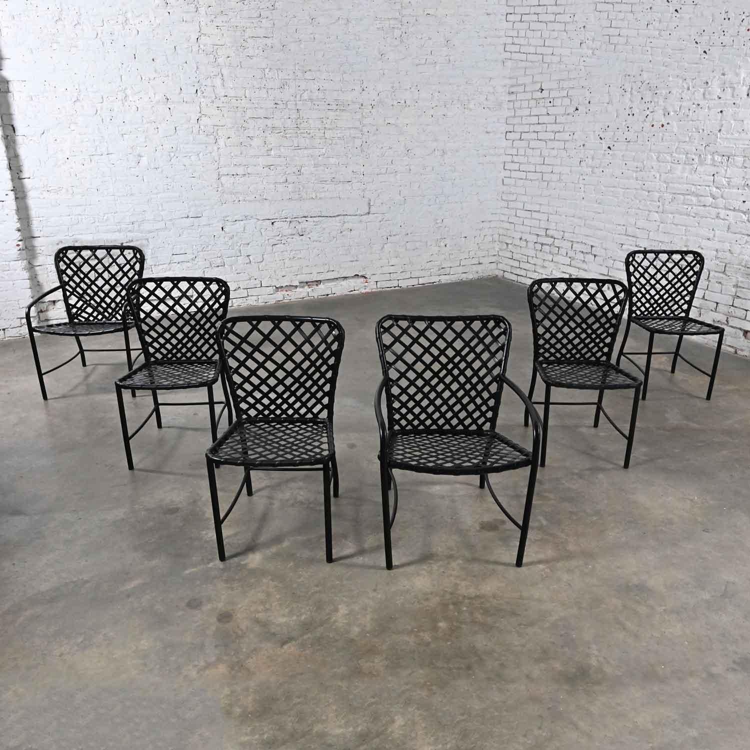 Wonderful vintage MCM (Mid Century Modern) Brown Jordan Tamiami outdoor dining chairs by Hall Bradley 4 side and 2 armchairs, set of 6. Comprised of aluminum frames with woven vinyl slings. They have been given a new spray coated black vinyl dye on